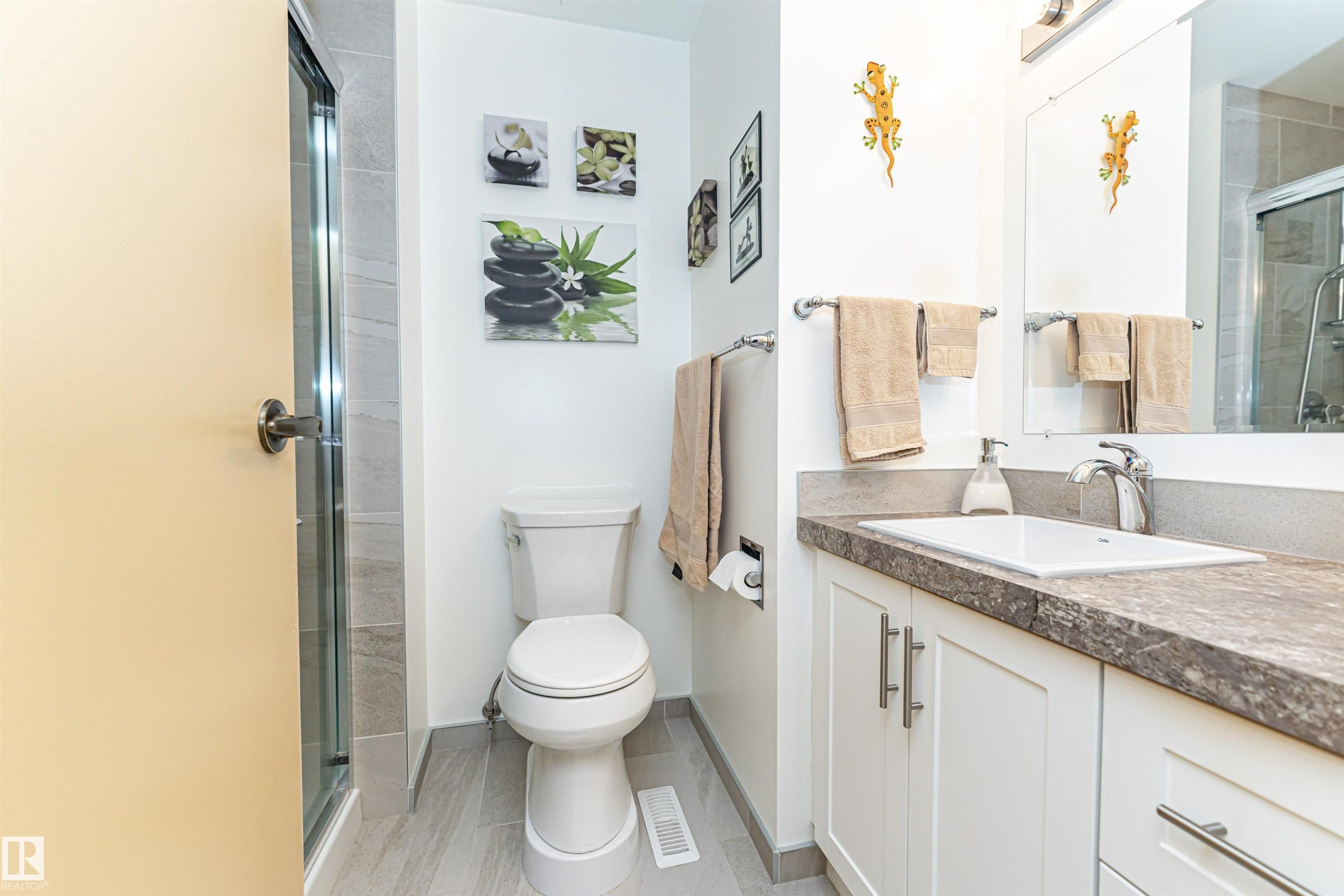 Bathroom featuring vanity and a stall shower - 2112 67 Street Nw, Edmonton, AB - Indoor Photo Showing Bathroom