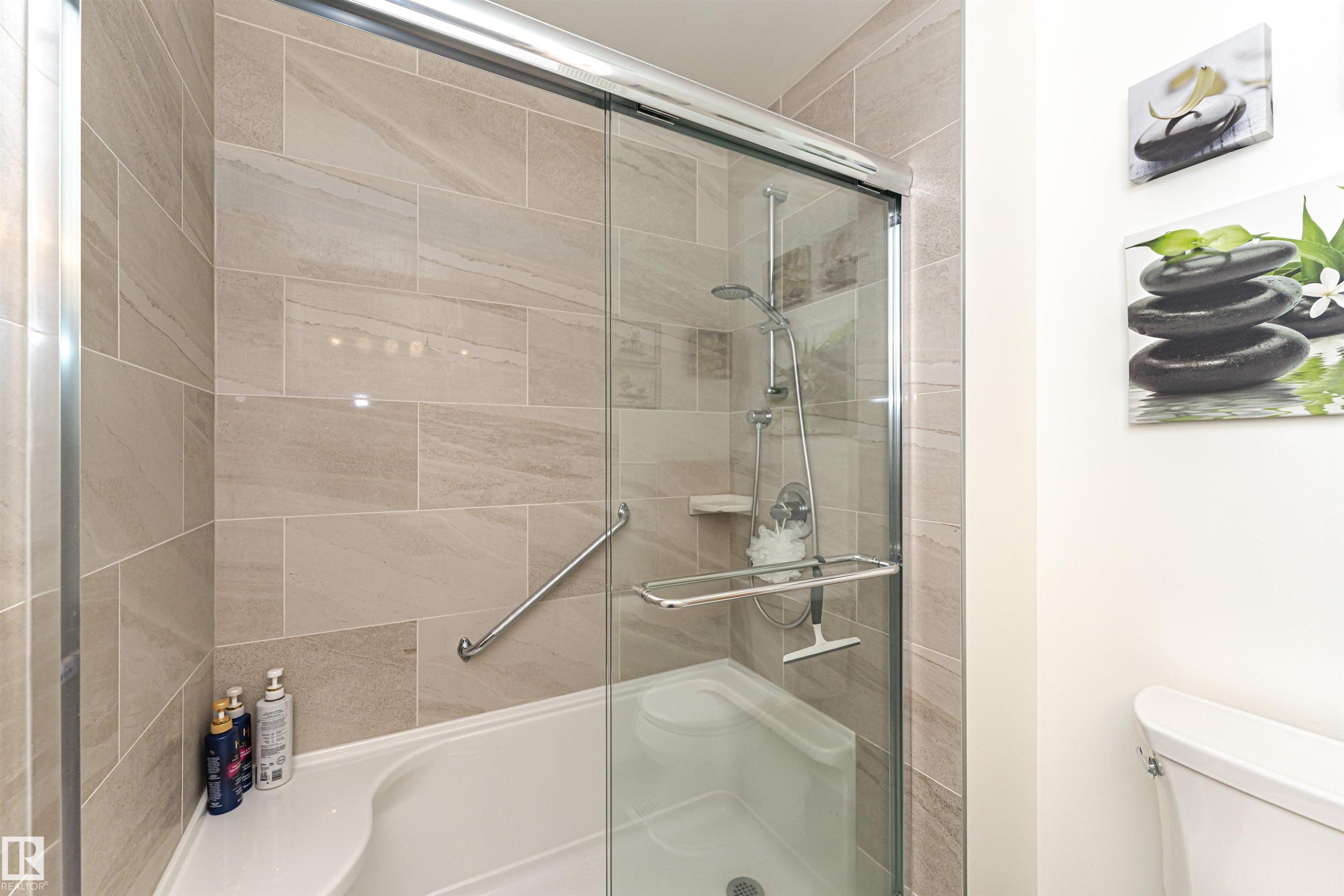 Bathroom with a shower stall and toilet - 2112 67 Street Nw, Edmonton, AB - Indoor Photo Showing Bathroom