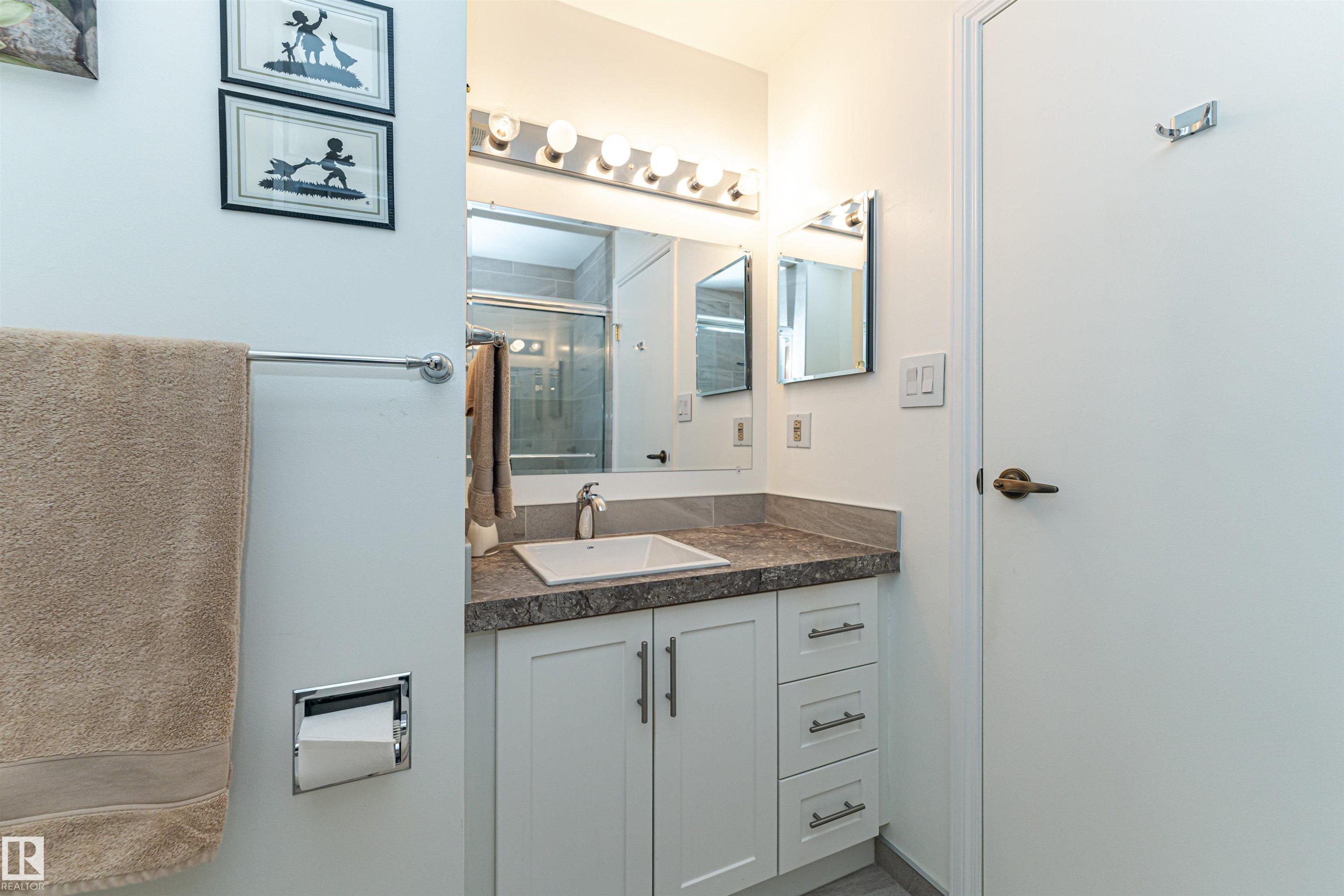 Full bath featuring vanity and a stall shower - 2112 67 Street Nw, Edmonton, AB - Indoor Photo Showing Bathroom