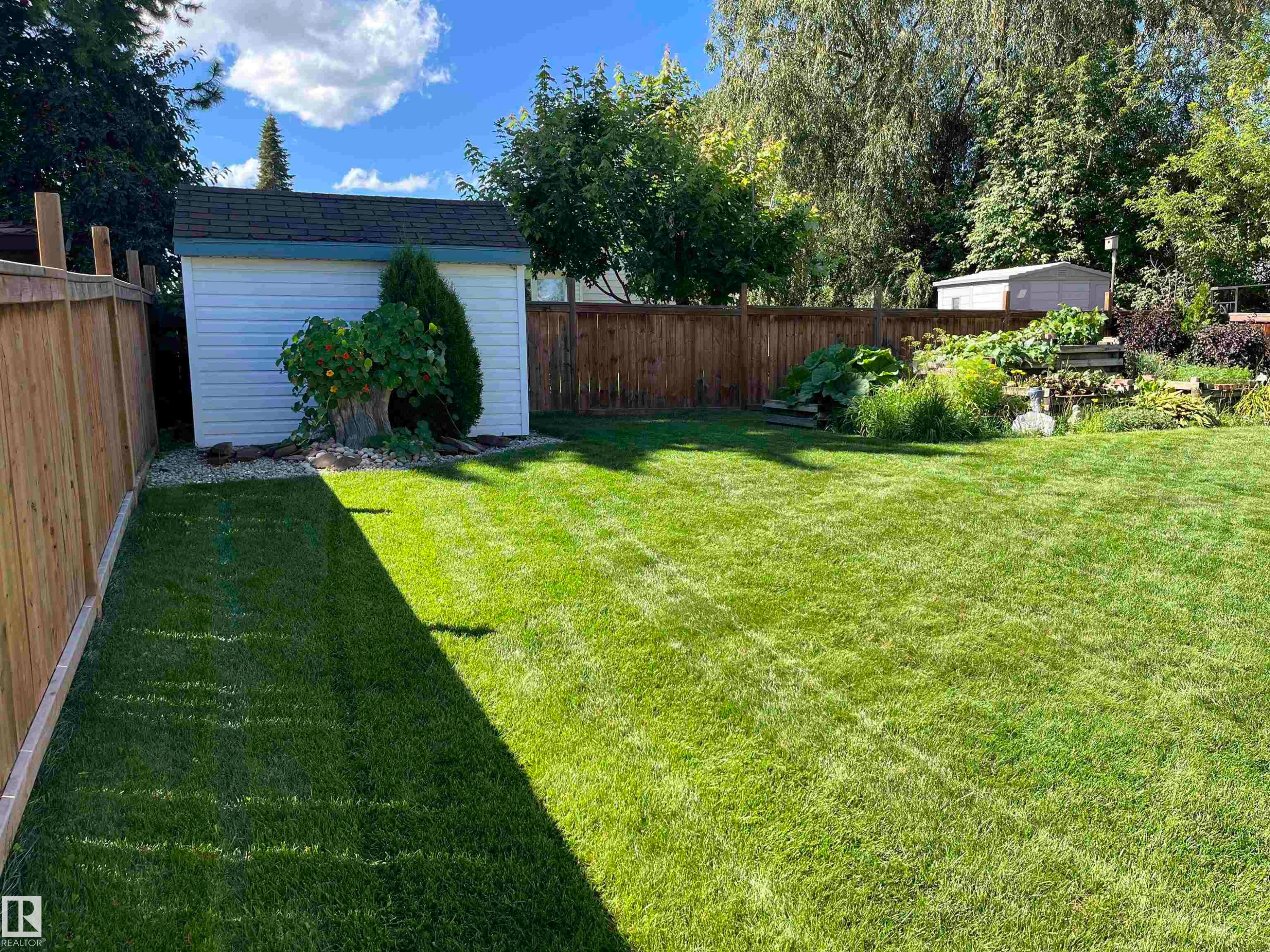 Fenced backyard with a storage shed - 2112 67 Street Nw, Edmonton, AB - Outdoor