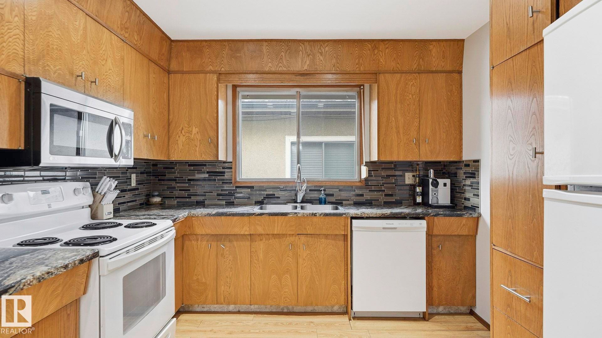 8911 83 Avenue, Edmonton, AB - Indoor Photo Showing Kitchen With Double Sink