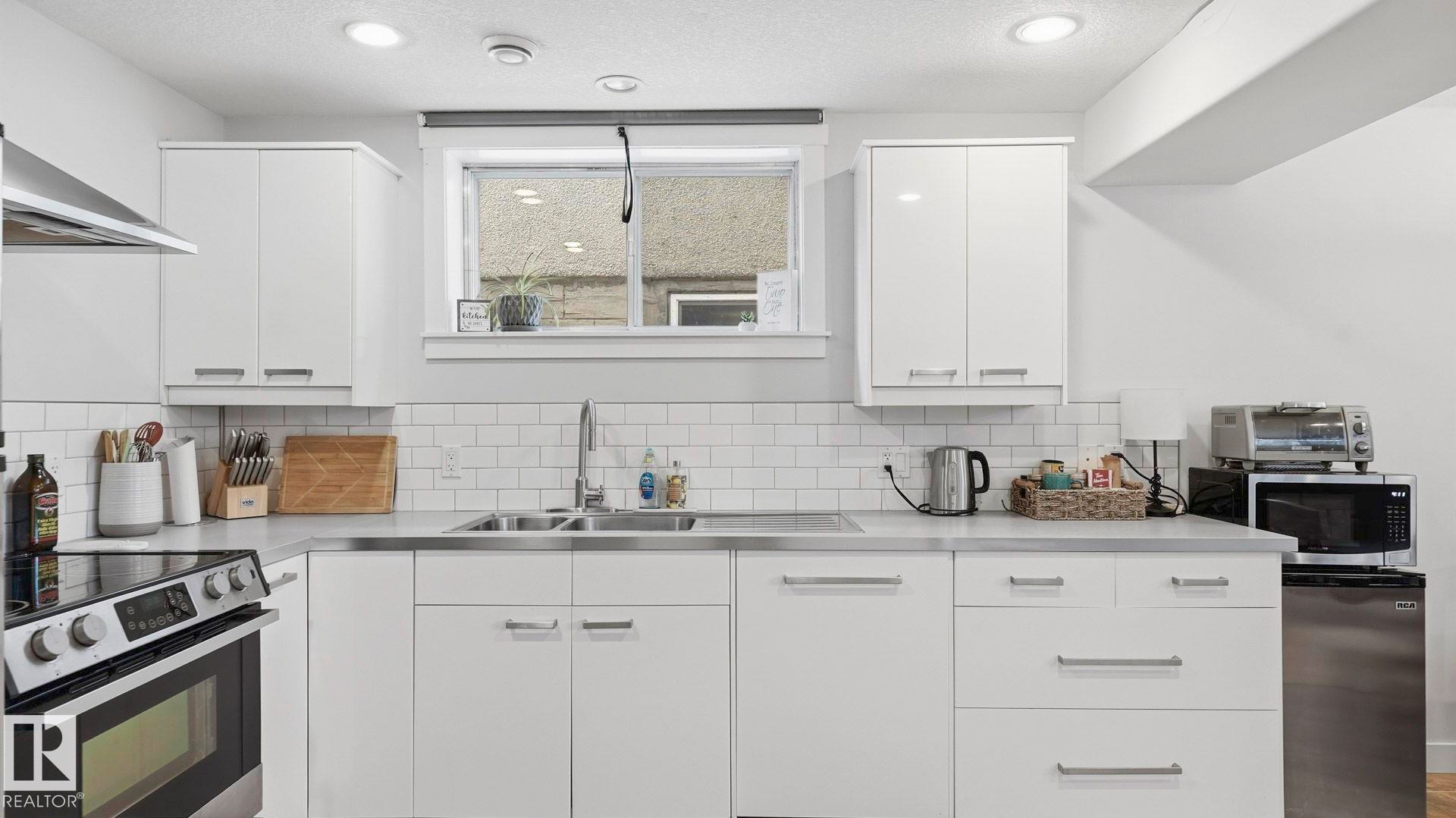 8911 83 Avenue, Edmonton, AB - Indoor Photo Showing Kitchen With Double Sink