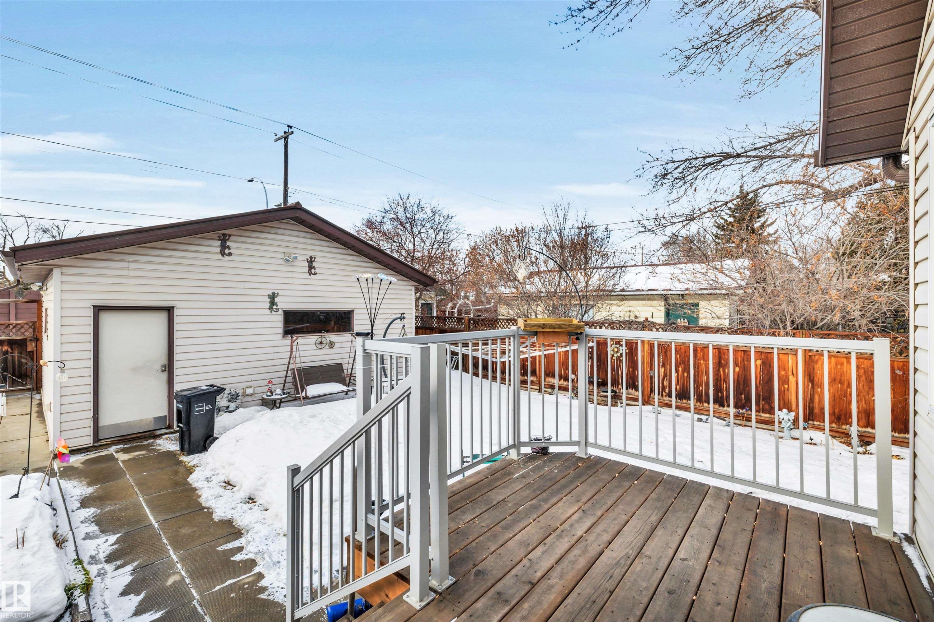 View of snow covered deck - 11432 71 Street, Edmonton, AB - Outdoor With Exterior
