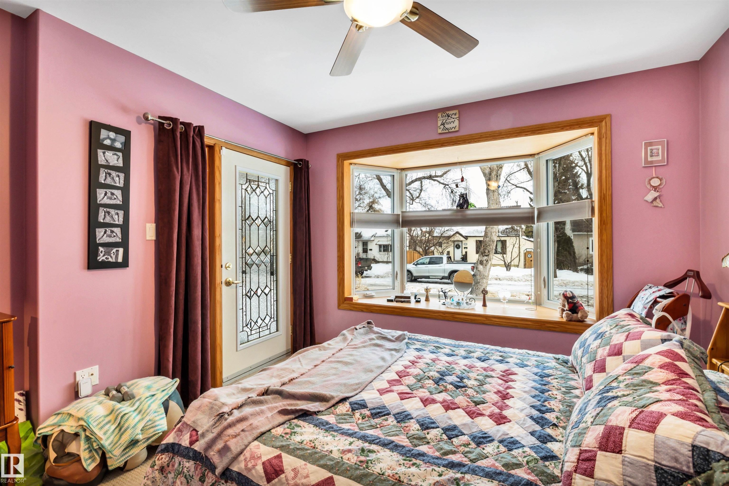Bedroom featuring a ceiling fan and access to exterior - 11432 71 Street, Edmonton, AB - Indoor Photo Showing Bedroom