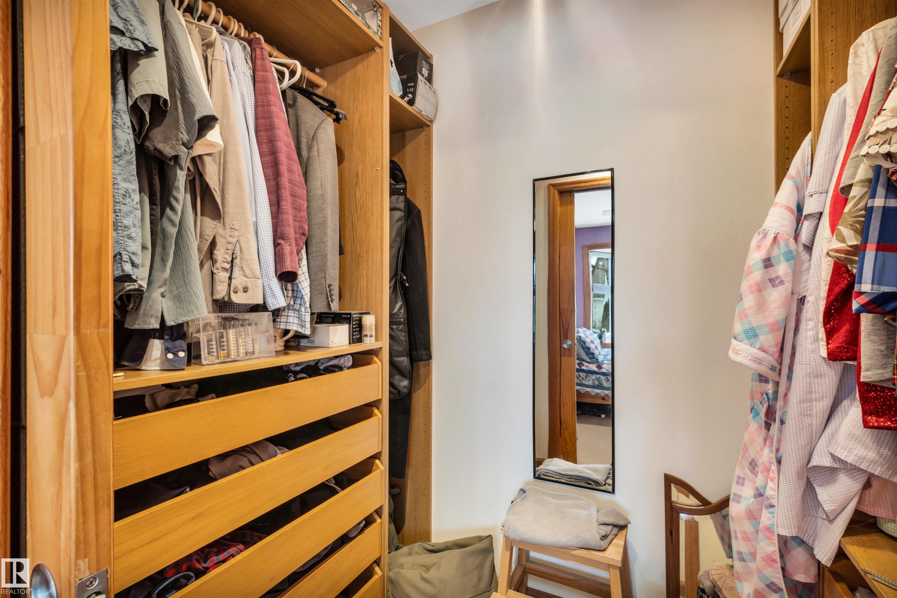 View of walk in closet - 11432 71 Street, Edmonton, AB - Indoor With Storage