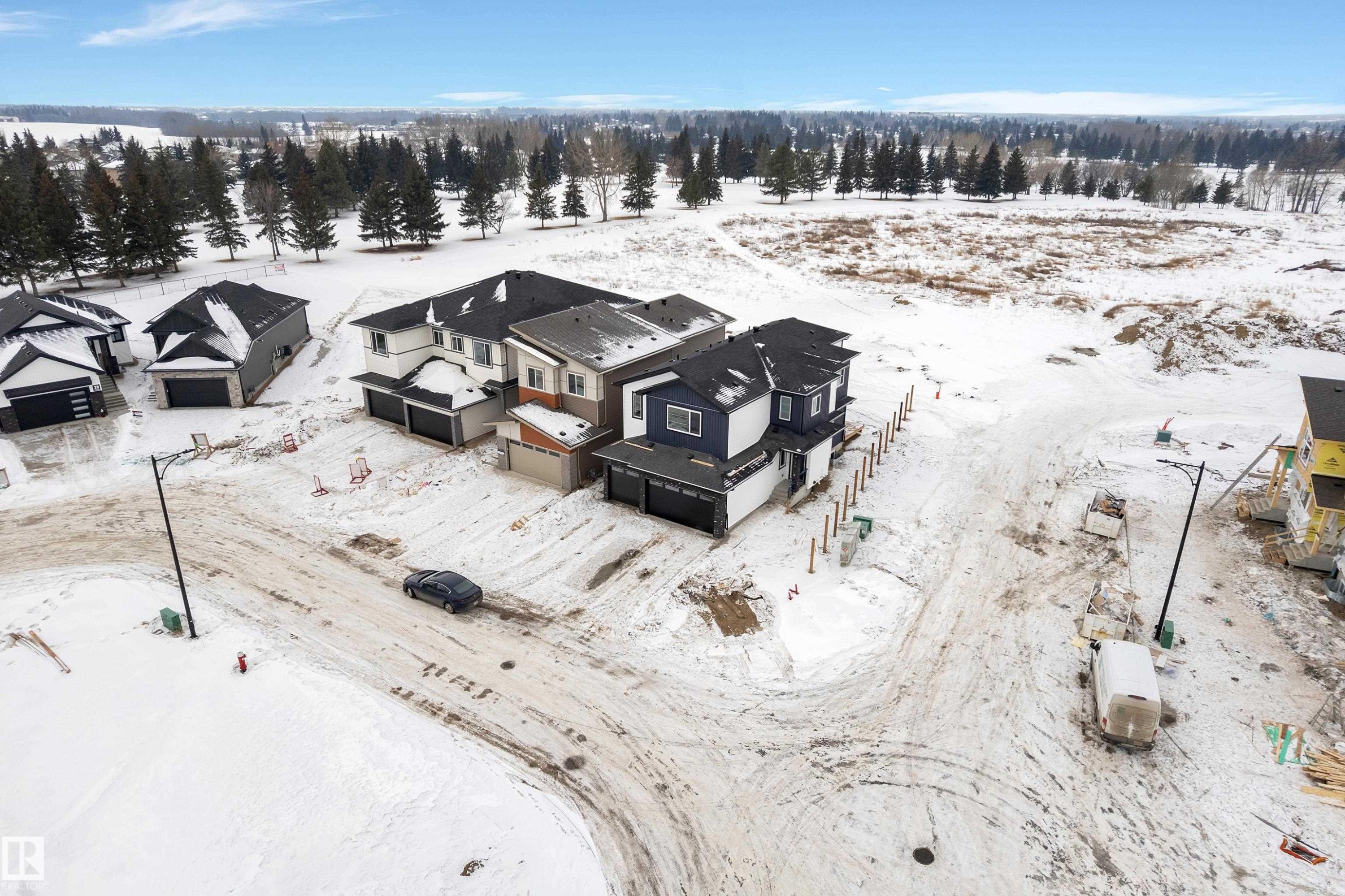 Snowy aerial view featuring a residential view - 40 Grayson Green, Stony Plain, AB - Outdoor With View