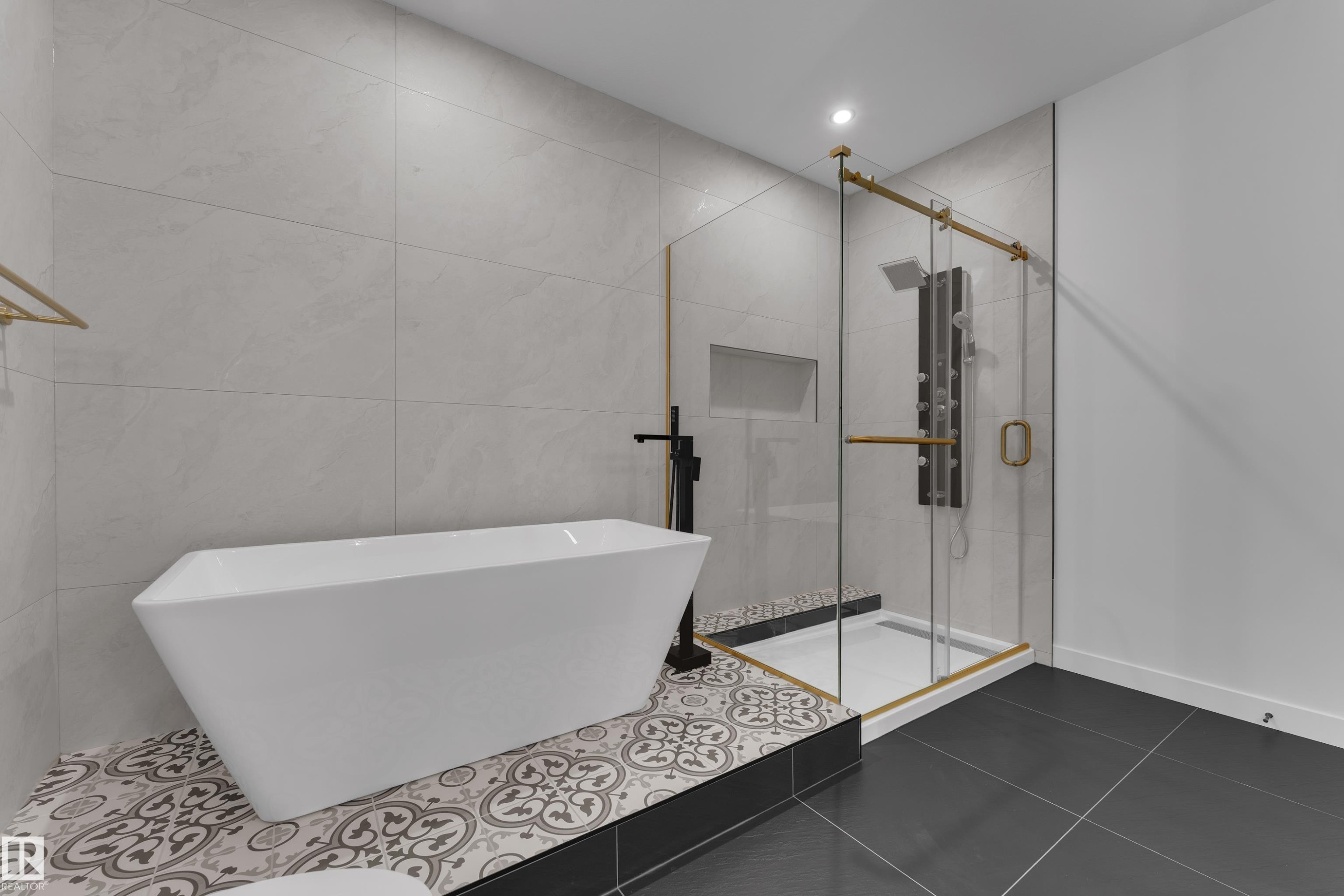 Bathroom featuring a shower stall, a freestanding bath, tile walls, dark tile patterned flooring, and recessed lighting - 40 Grayson Green, Stony Plain, AB - Indoor Photo Showing Bathroom