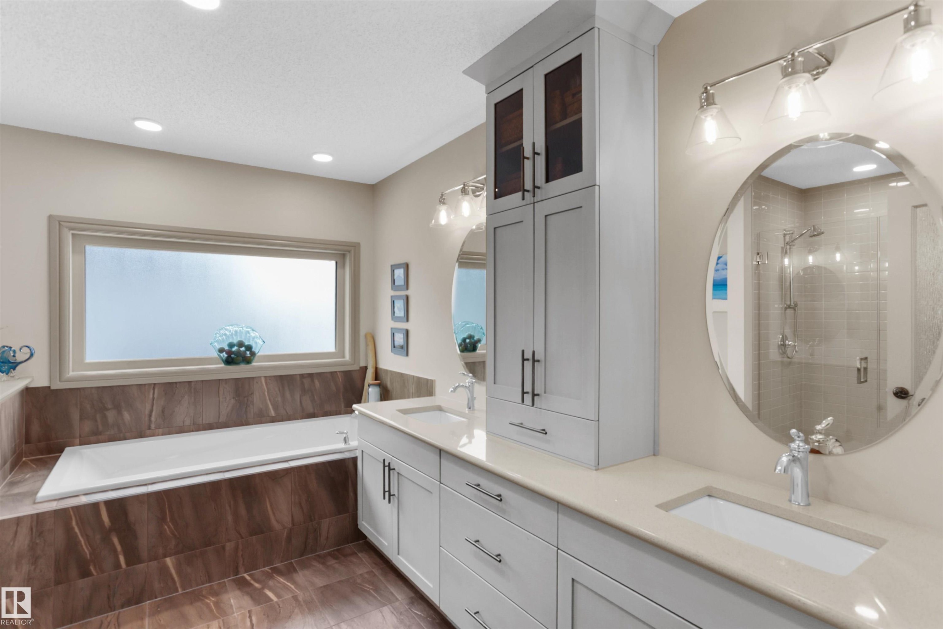 Full bathroom with double vanity, a shower stall, a garden tub, and recessed lighting - 97 Astoria Point(E), Devon, AB - Indoor Photo Showing Bathroom