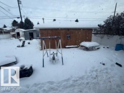 View of yard covered in snow -