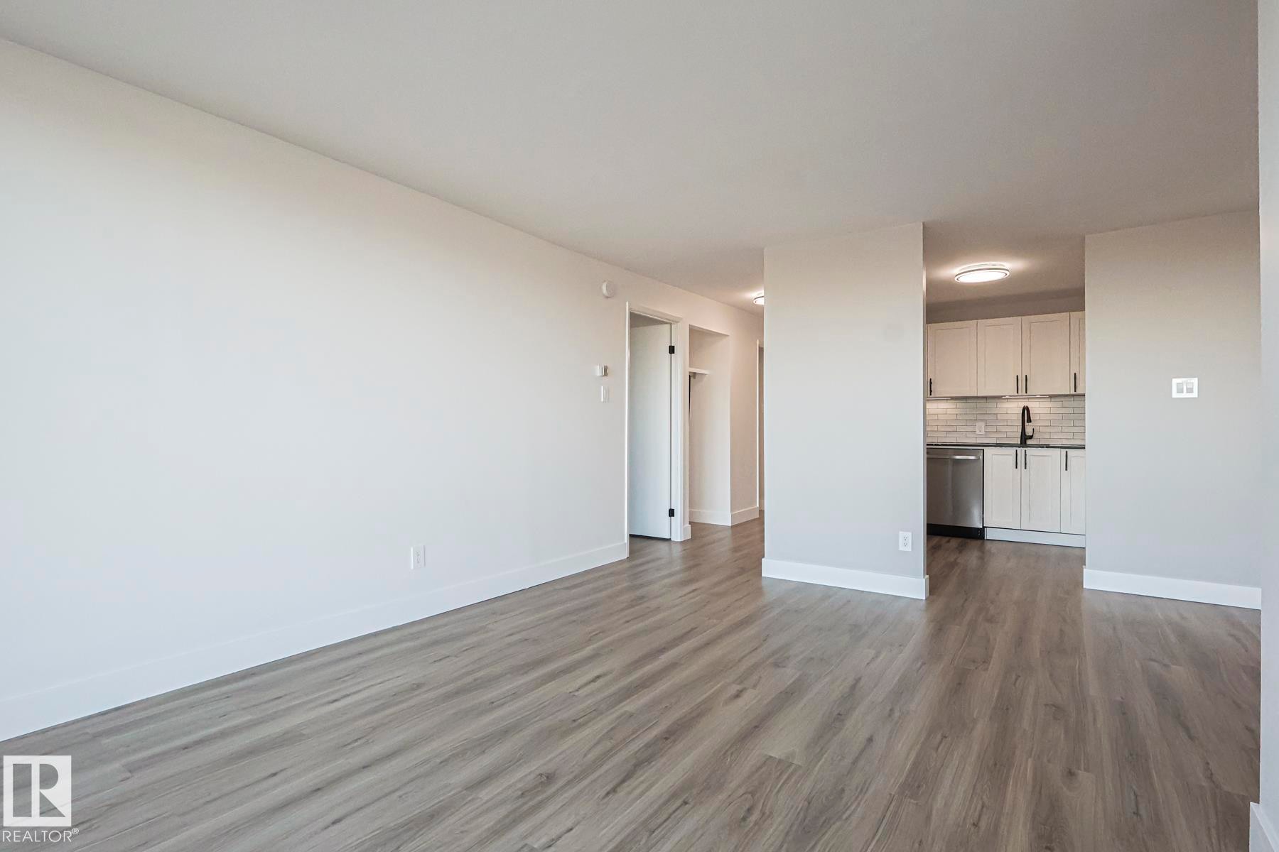 Living room featuring vinyl plank flooring - 505 10149 Saskatchewan Drive, Edmonton, AB - Indoor Photo Showing Other Room