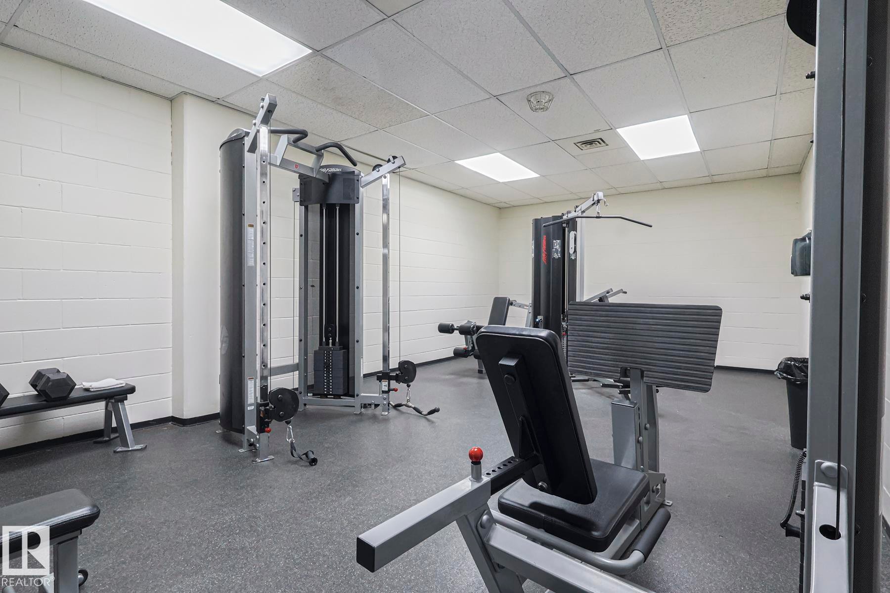 Exercise room with a drop ceiling - 505 10149 Saskatchewan Drive, Edmonton, AB - Indoor Photo Showing Gym Room