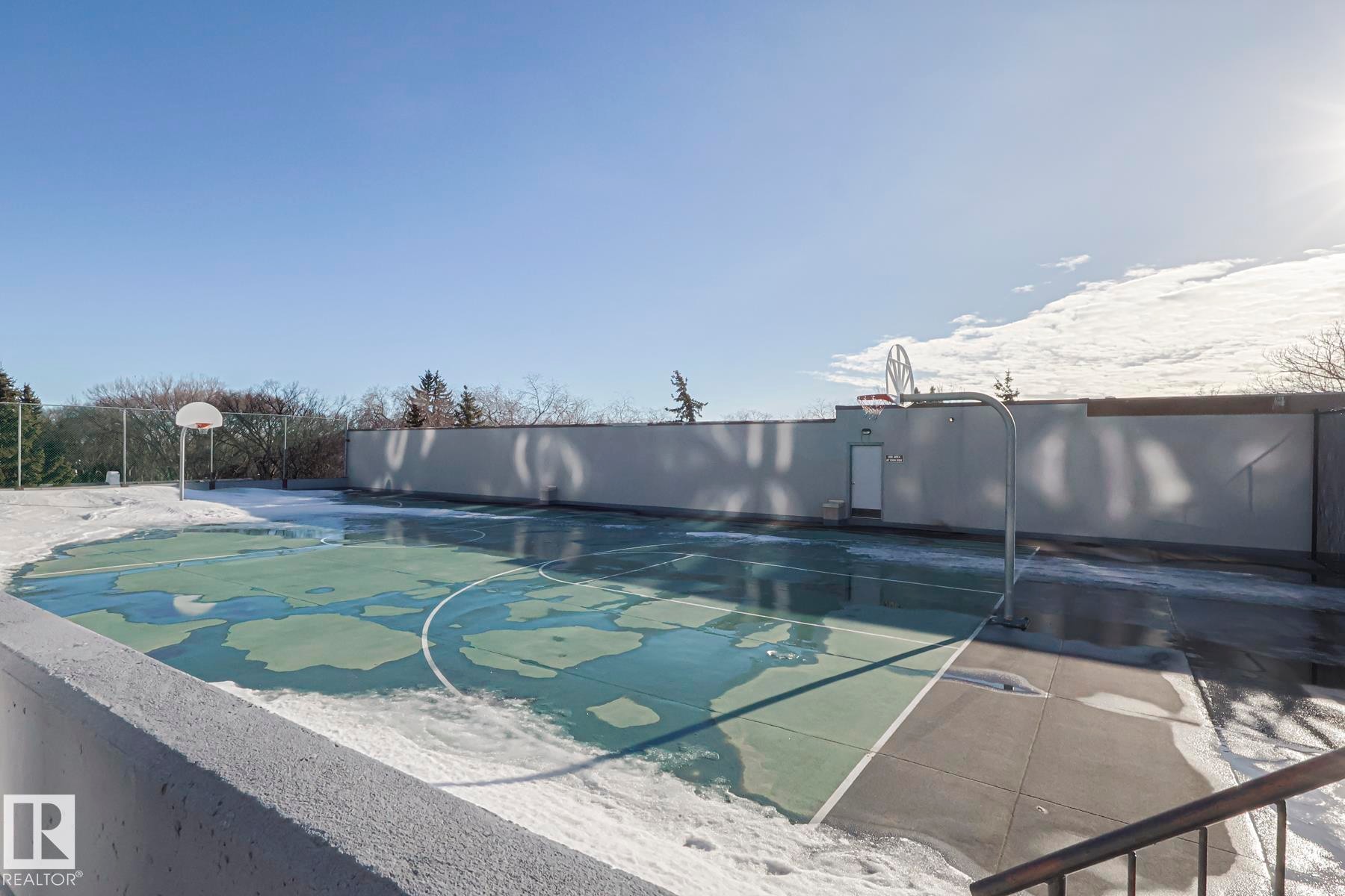 View of community basketball court and a patio on top of Parkade which has excellent visitor parking! - 505 10149 Saskatchewan Drive, Edmonton, AB - Outdoor