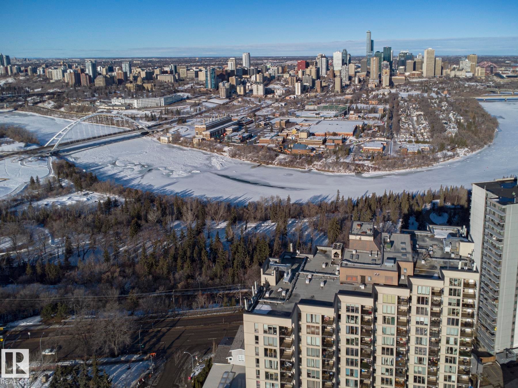 Aerial view of property and surrounding area with nearby urban area - 505 10149 Saskatchewan Drive, Edmonton, AB - Outdoor With View