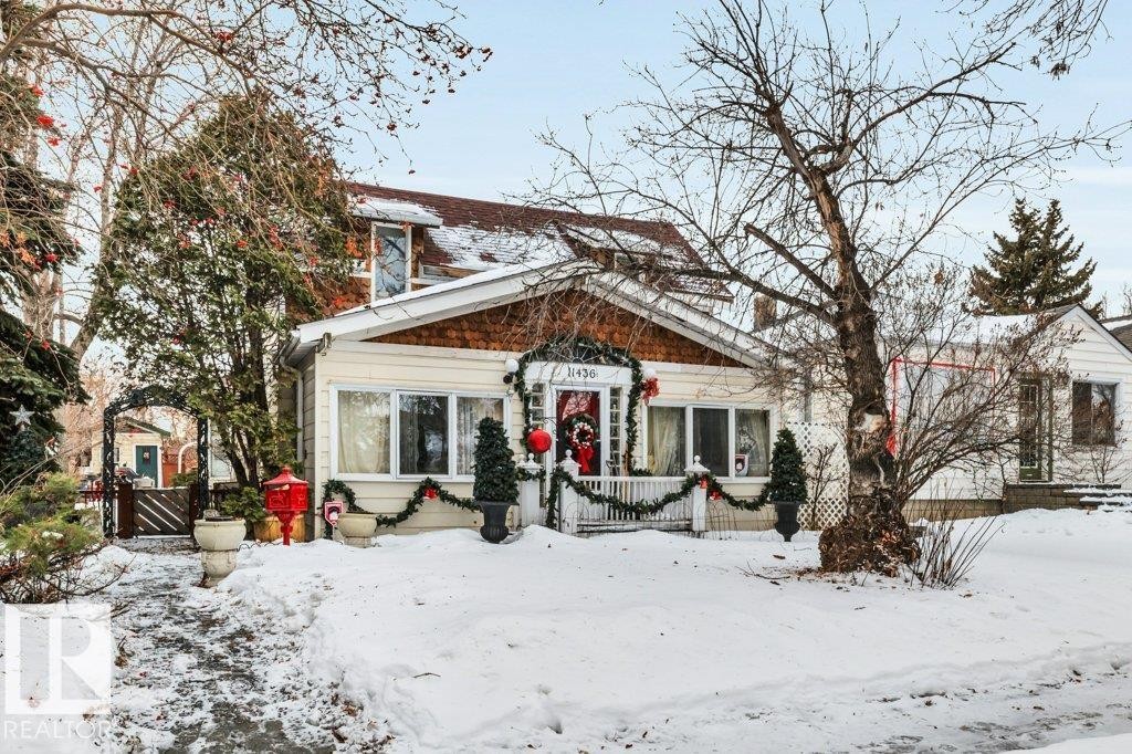 View of front of house with a wooden deck - 11436 71 Street, Edmonton, AB - Outdoor