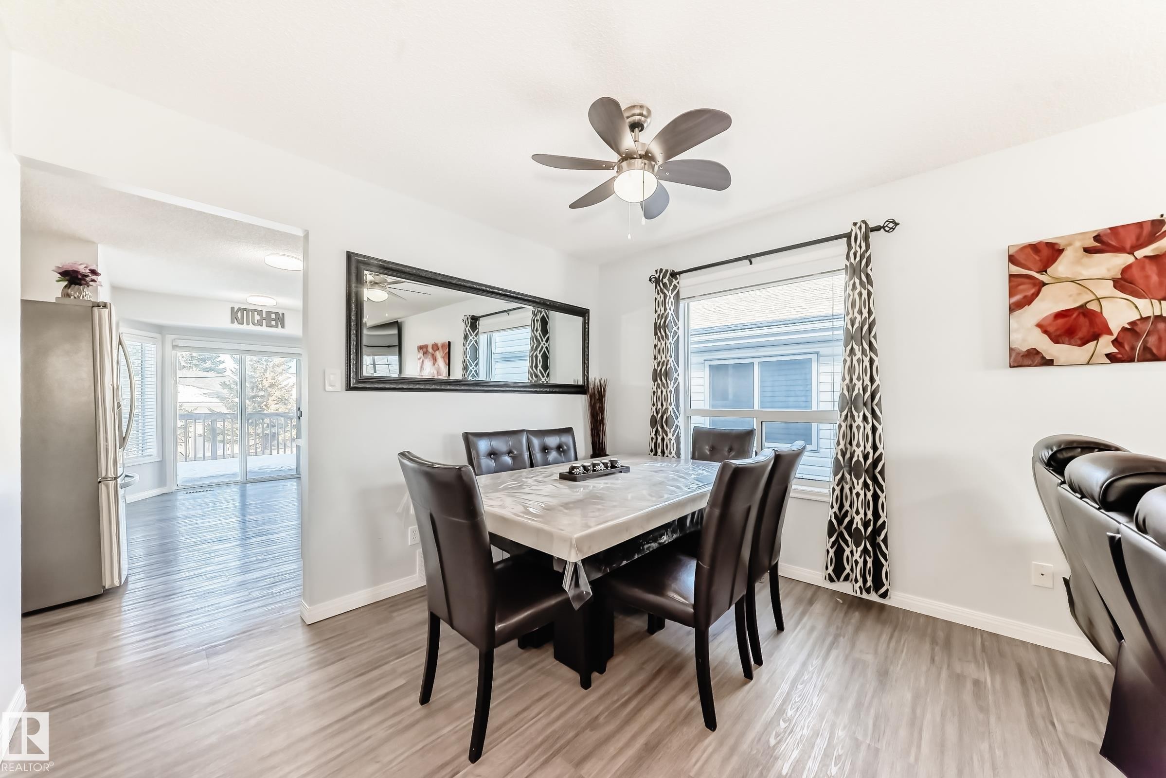 Dining space with plenty of natural light, light wood finished floors, and a ceiling fan - 6 Jefferson Road, Edmonton, AB - Indoor Photo Showing Dining Room