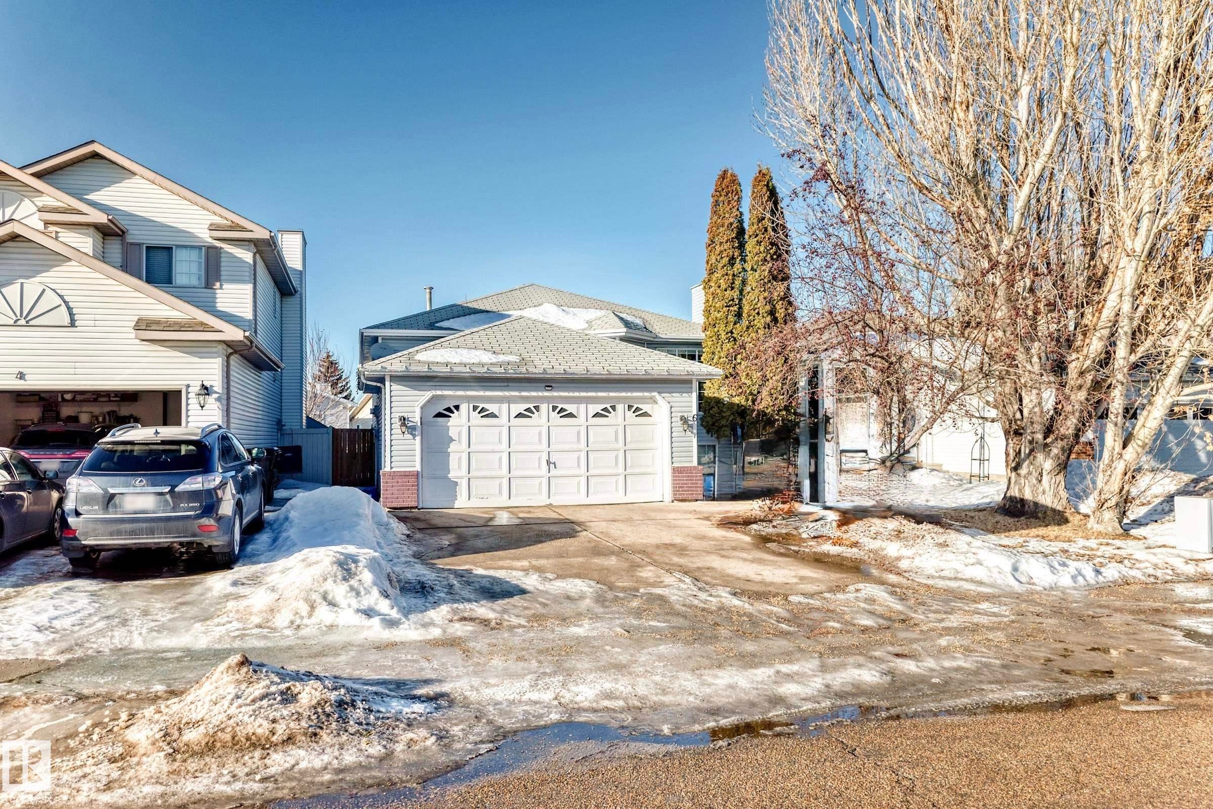 View of front of home featuring concrete driveway, brick siding, and a garage - 6 Jefferson Road, Edmonton, AB - Outdoor