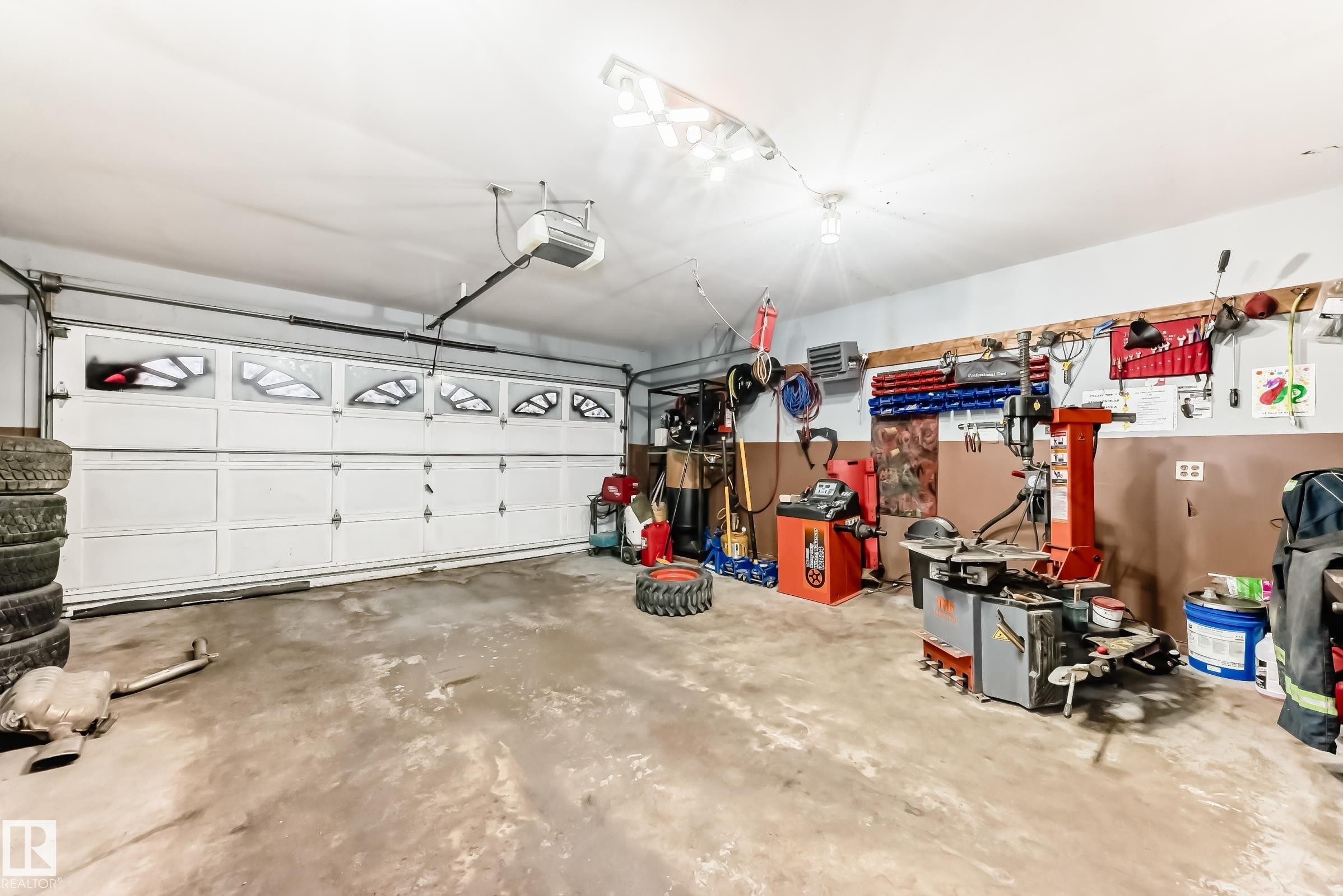 Garage with a heating unit and a garage door opener - 6 Jefferson Road, Edmonton, AB - Indoor Photo Showing Garage