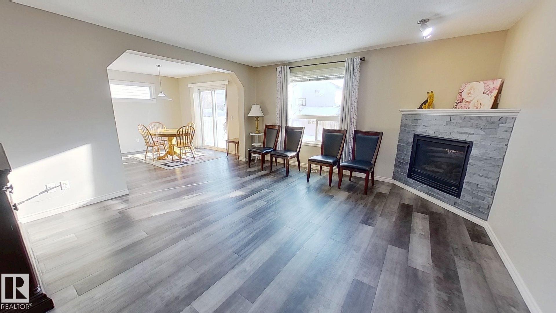 3811 Mclean Close, Edmonton, AB - Indoor Photo Showing Living Room With Fireplace