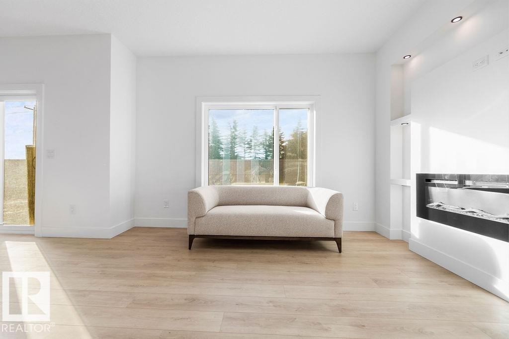 Living area featuring light wood-type flooring - 235 Linden Loop, Leduc, AB - Indoor