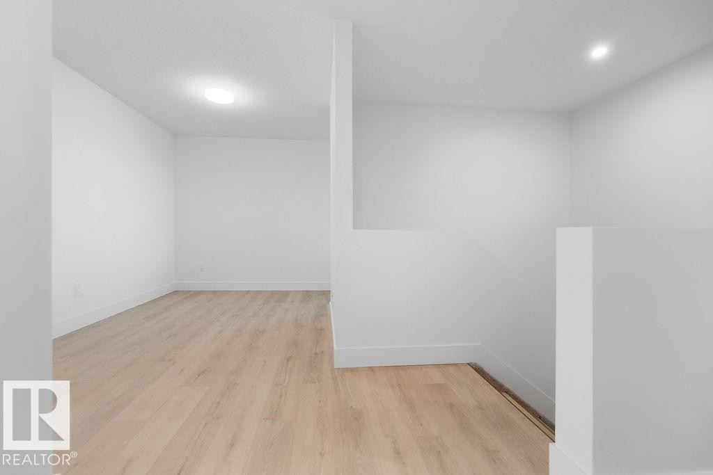 Spare room with light wood-style flooring and recessed lighting - 235 Linden Loop, Leduc, AB - Indoor Photo Showing Other Room