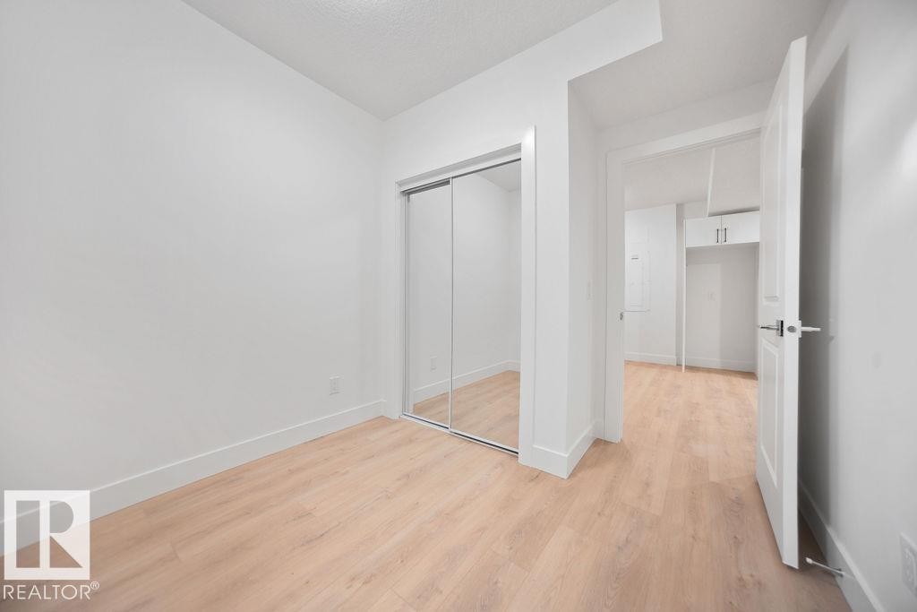 Unfurnished bedroom with light wood finished floors and a closet - 235 Linden Loop, Leduc, AB - Indoor Photo Showing Other Room