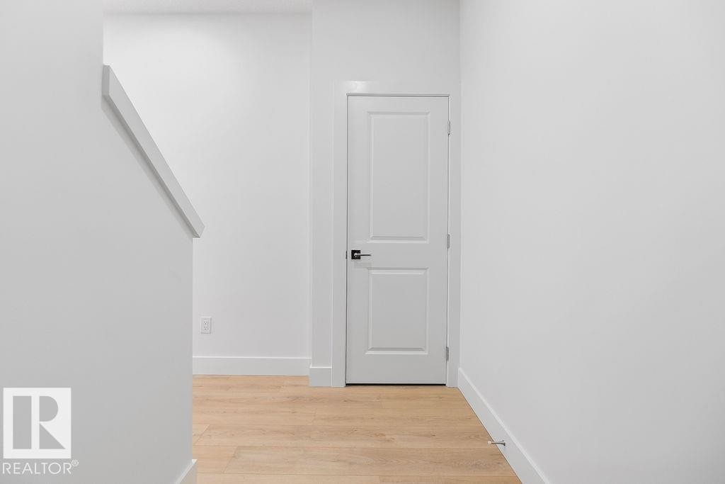 Hallway featuring light wood-style flooring and baseboards - 235 Linden Loop, Leduc, AB - Indoor Photo Showing Other Room
