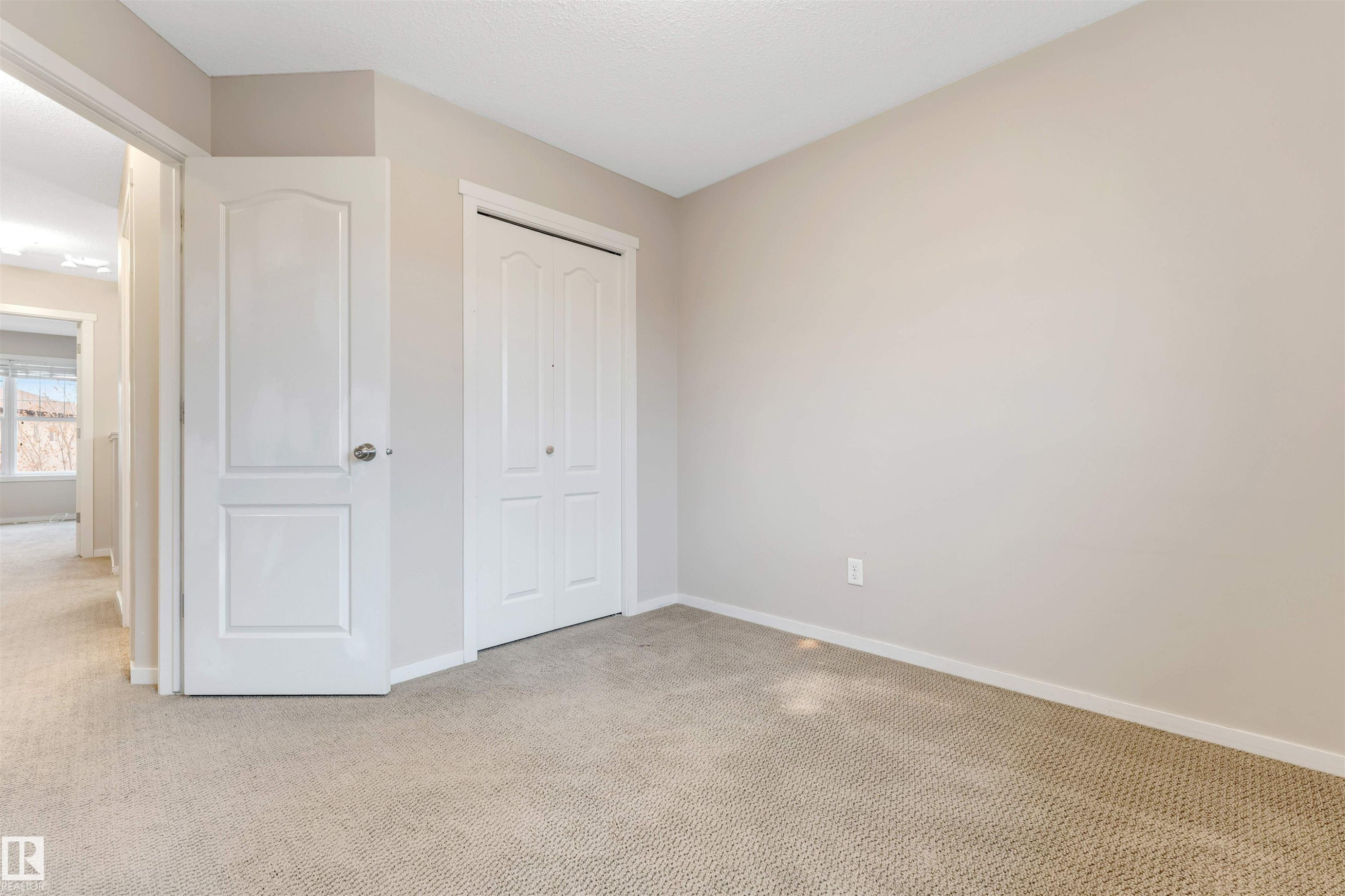 Unfurnished bedroom with carpet and a closet - 610 Tamarack Road, Edmonton, AB - Indoor Photo Showing Other Room
