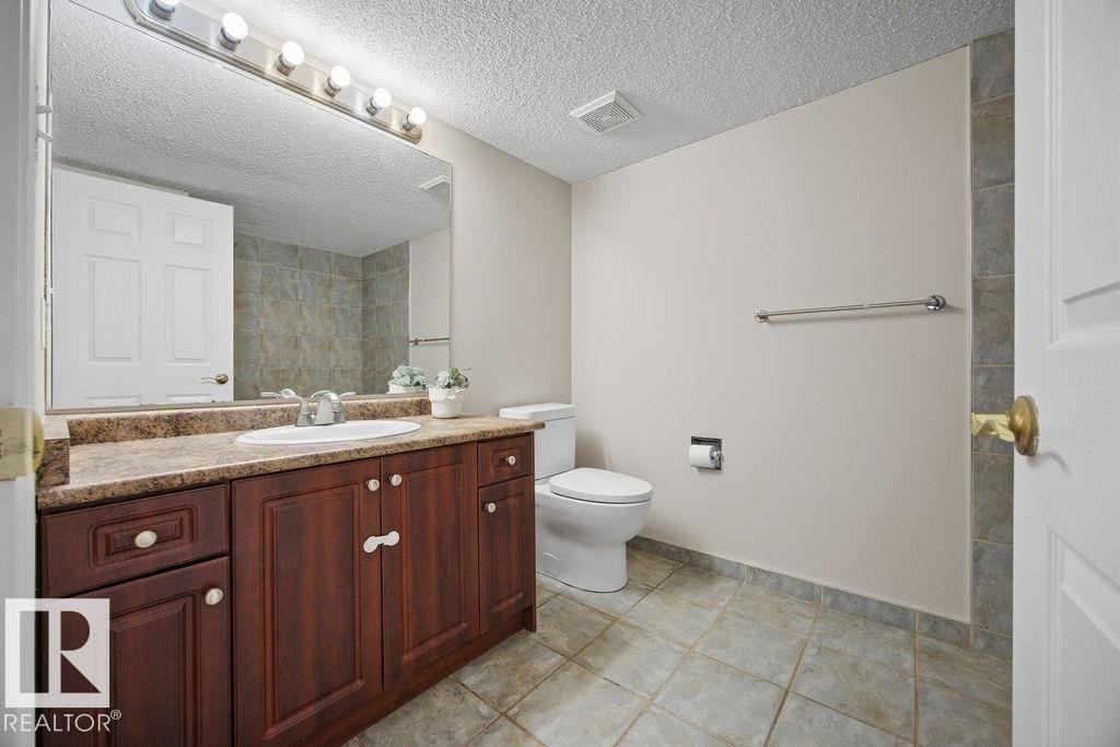 Full bathroom featuring vanity and a textured ceiling - 736 Johns Road, Edmonton, AB - Indoor Photo Showing Bathroom
