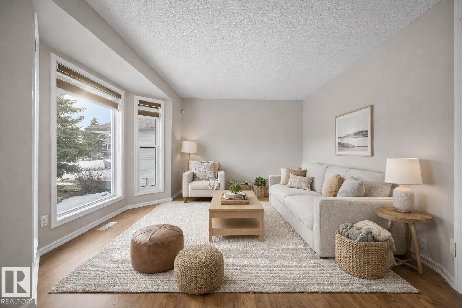 Living area featuring a textured ceiling and wood finished floors - 736 Johns Road, Edmonton, AB - Indoor Photo Showing Living Room