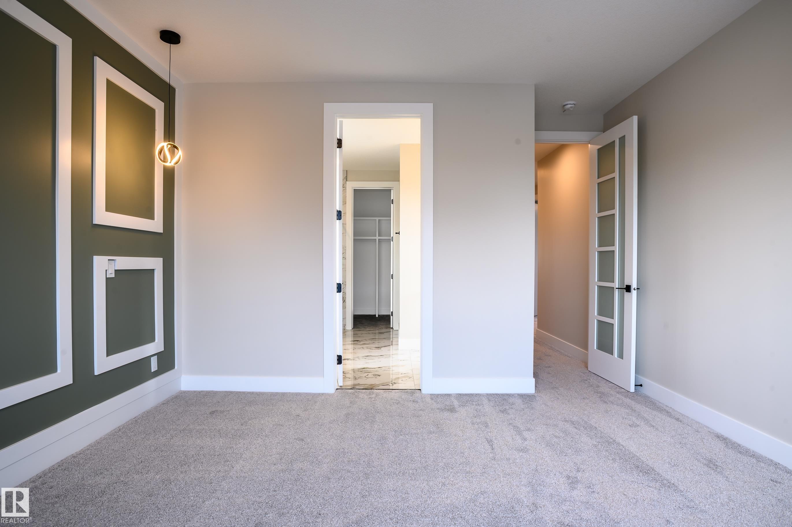 Unfurnished bedroom featuring carpet floors and baseboards - 16 Middleton Close, Leduc, AB - Indoor