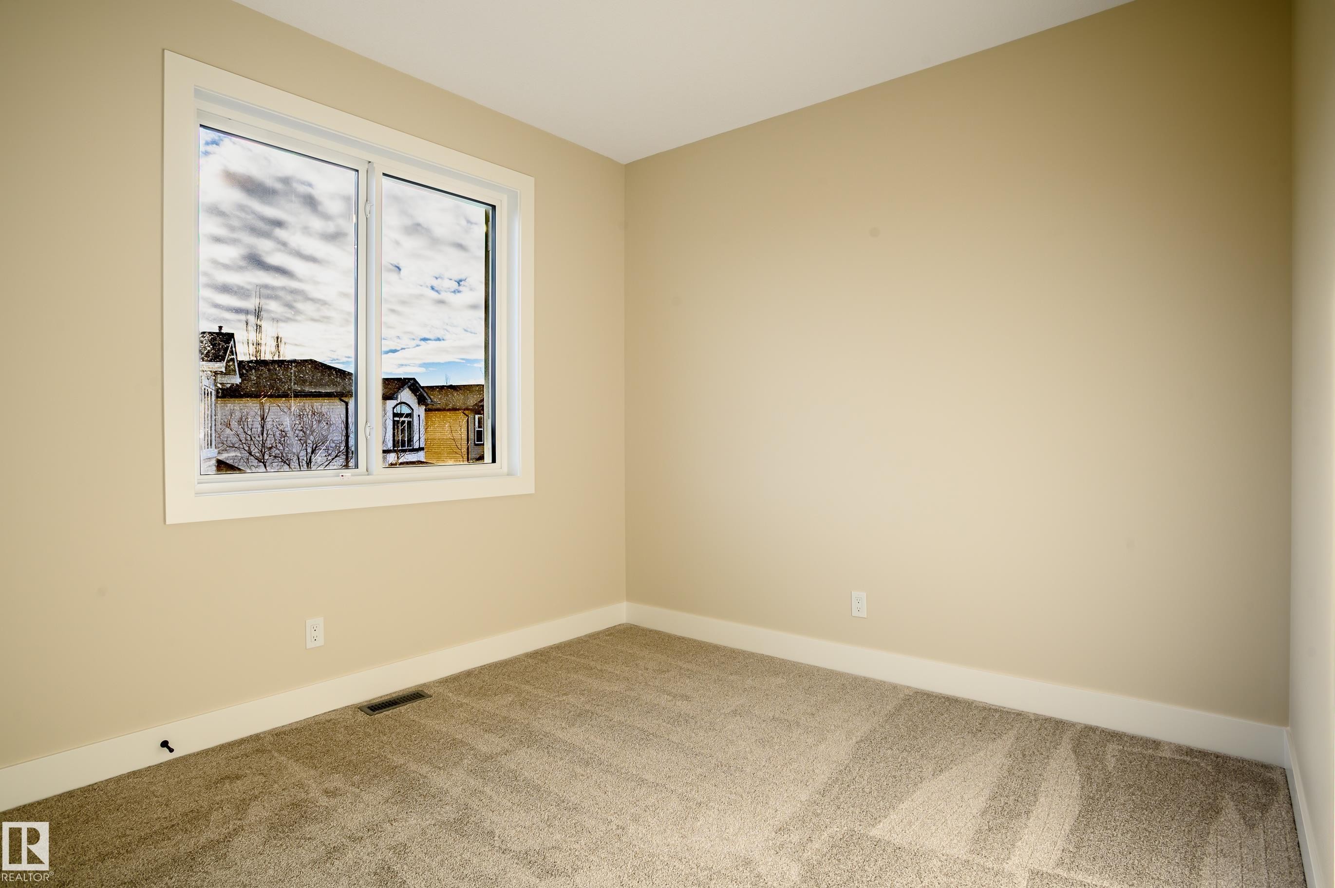 Unfurnished room featuring carpet and baseboards - 16 Middleton Close, Leduc, AB - Indoor Photo Showing Other Room