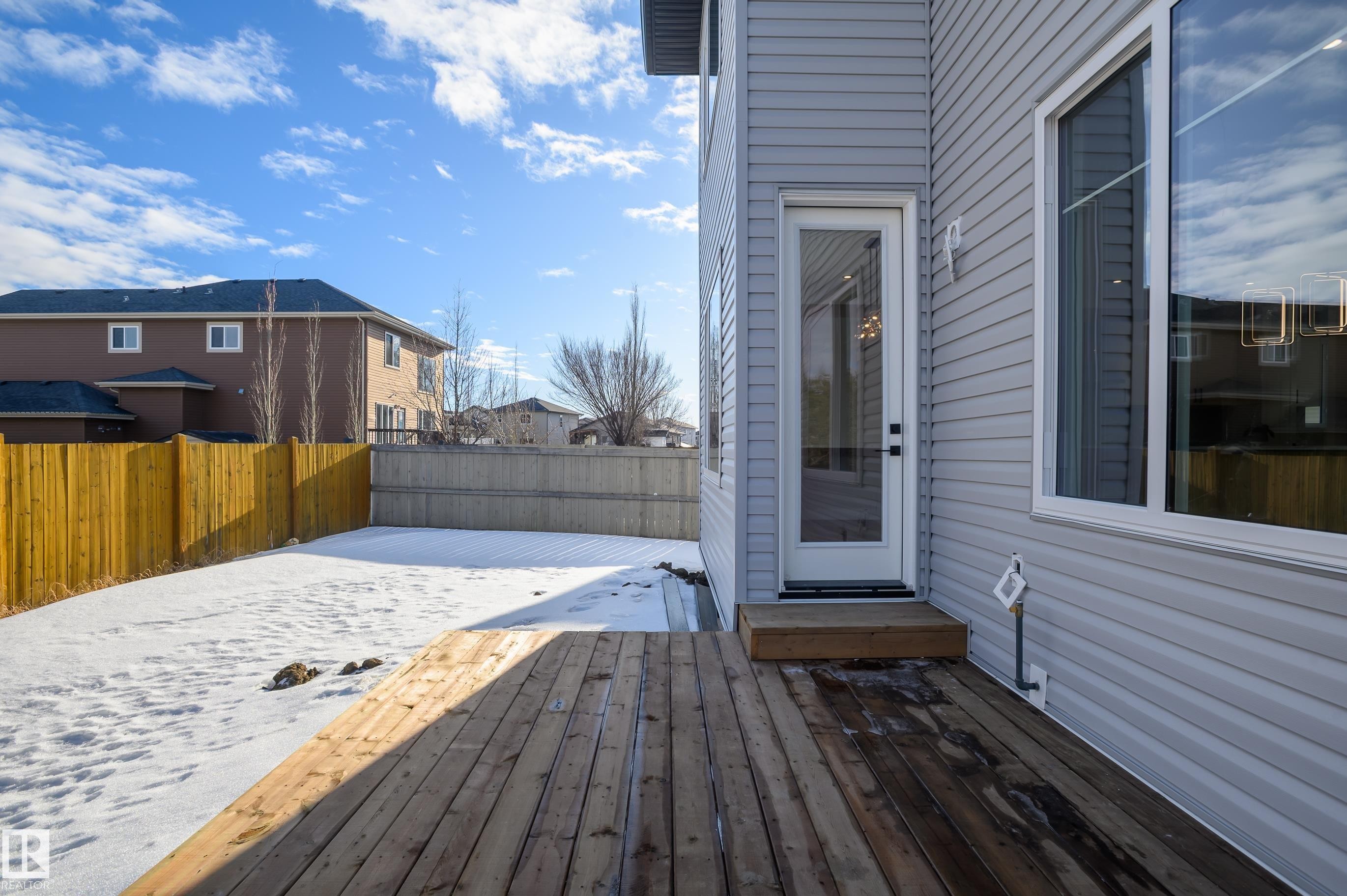 Back entrances from the patio - 16 Middleton Close, Leduc, AB - Outdoor With Exterior
