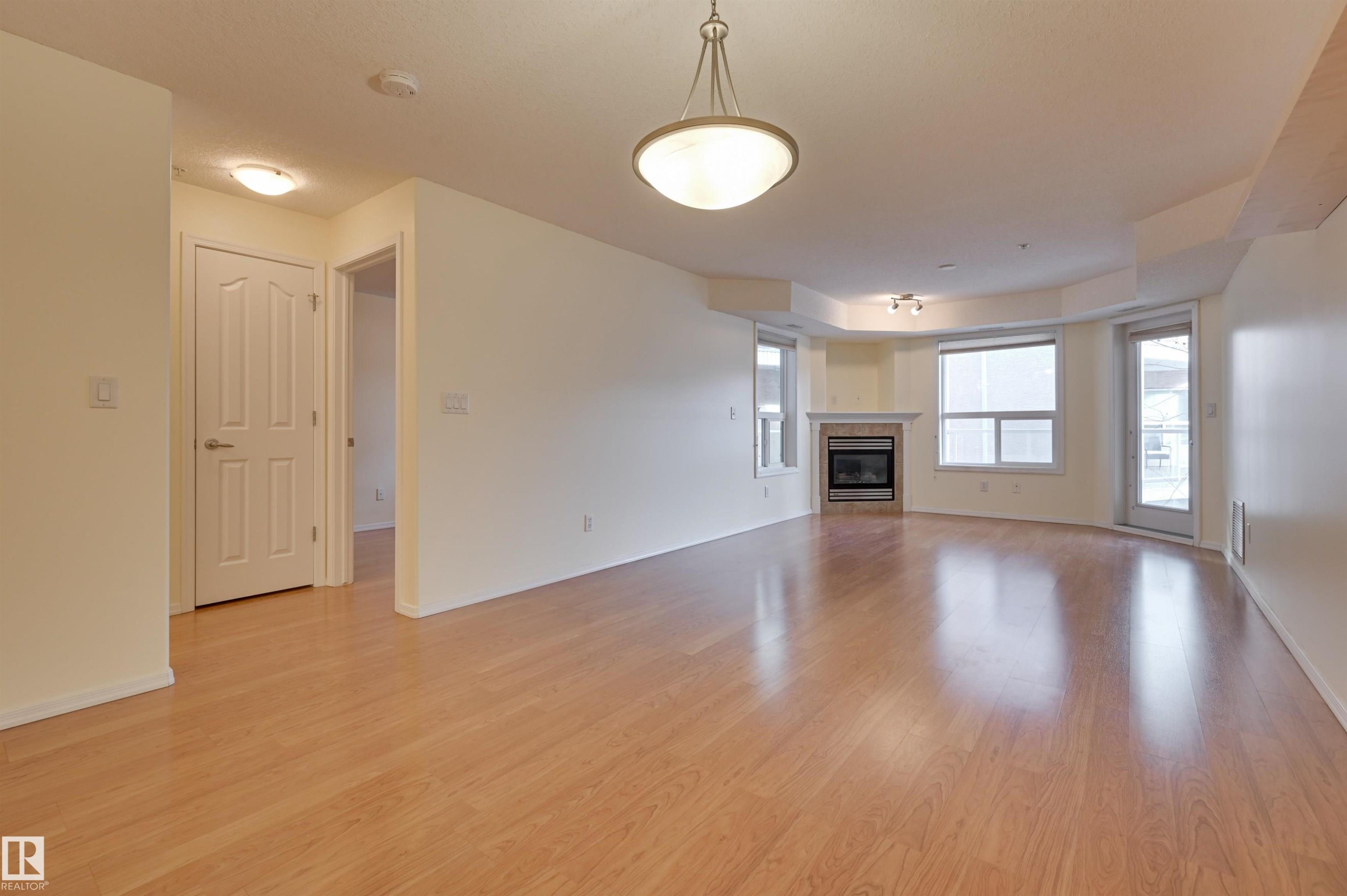 336 9008 99 Avenue, Edmonton, AB - Indoor Photo Showing Other Room With Fireplace