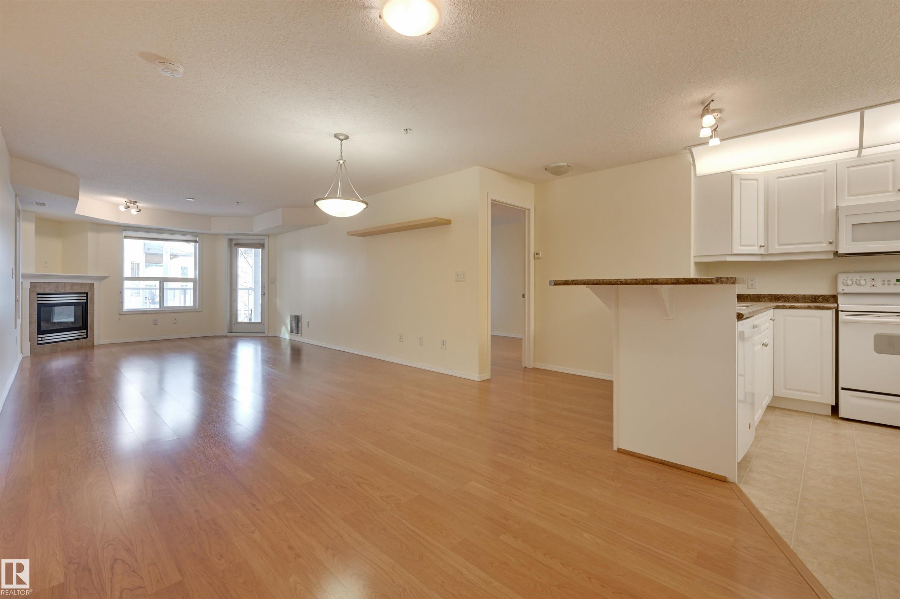 336 9008 99 Avenue, Edmonton, AB - Indoor Photo Showing Kitchen With Fireplace