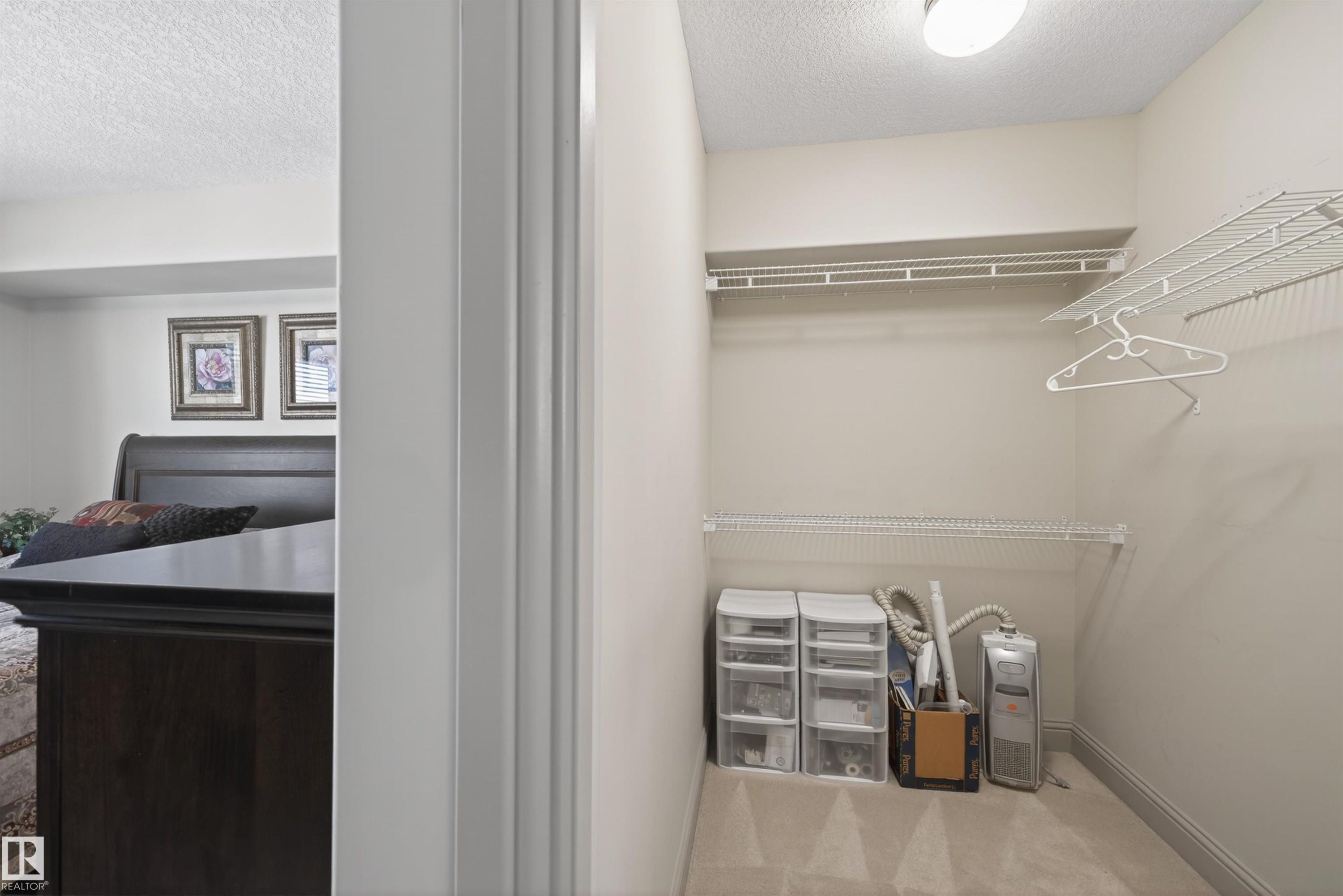 Walk in closet featuring carpet floors - 427 13005 140 Avenue, Edmonton, AB - Indoor With Storage