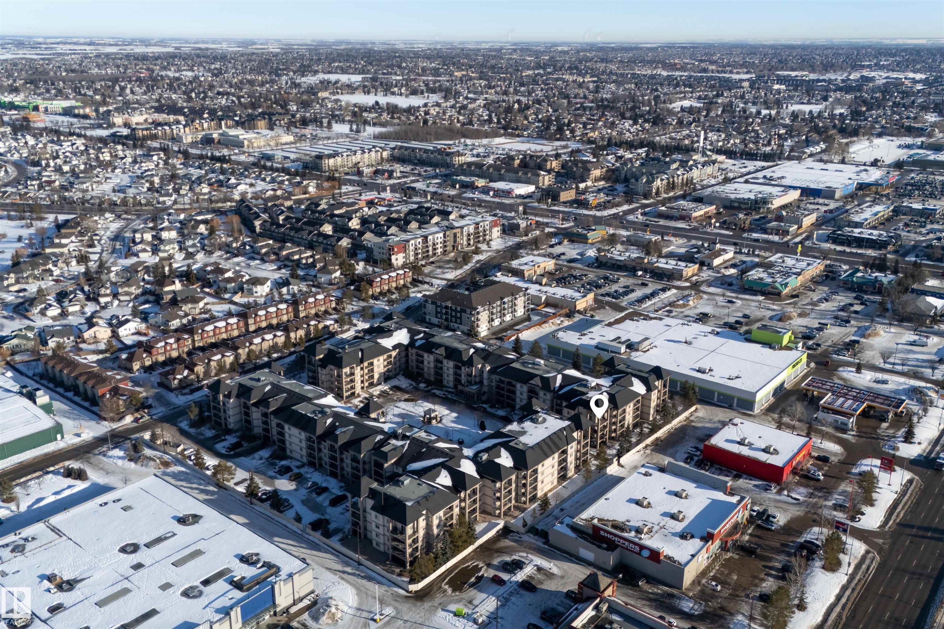 Aerial view of property and surrounding area with nearby urban area - 427 13005 140 Avenue, Edmonton, AB - Outdoor With View