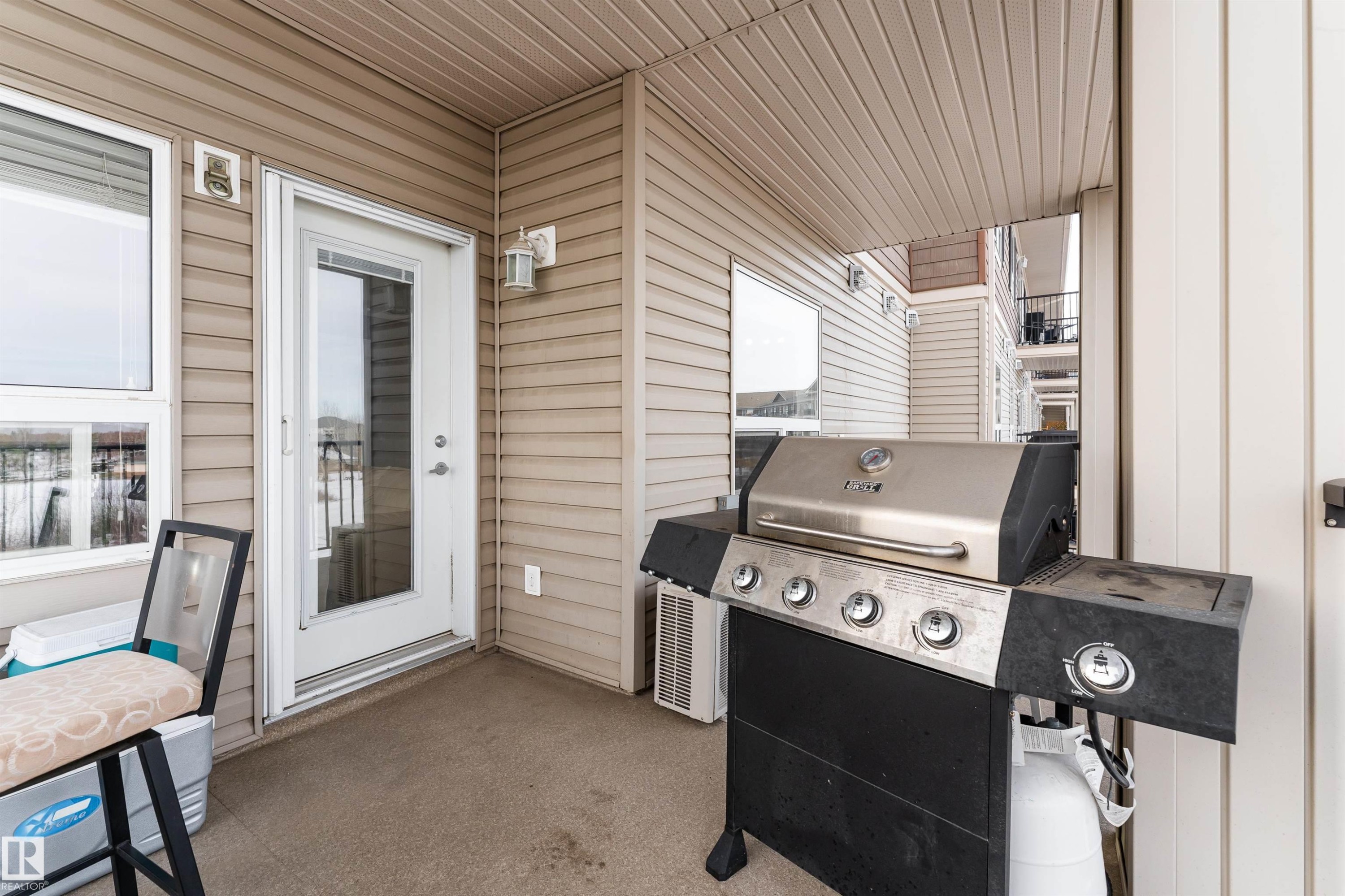 View of patio with grilling area - 325 1520 Hammond Gate, Edmonton, AB - Outdoor With Exterior