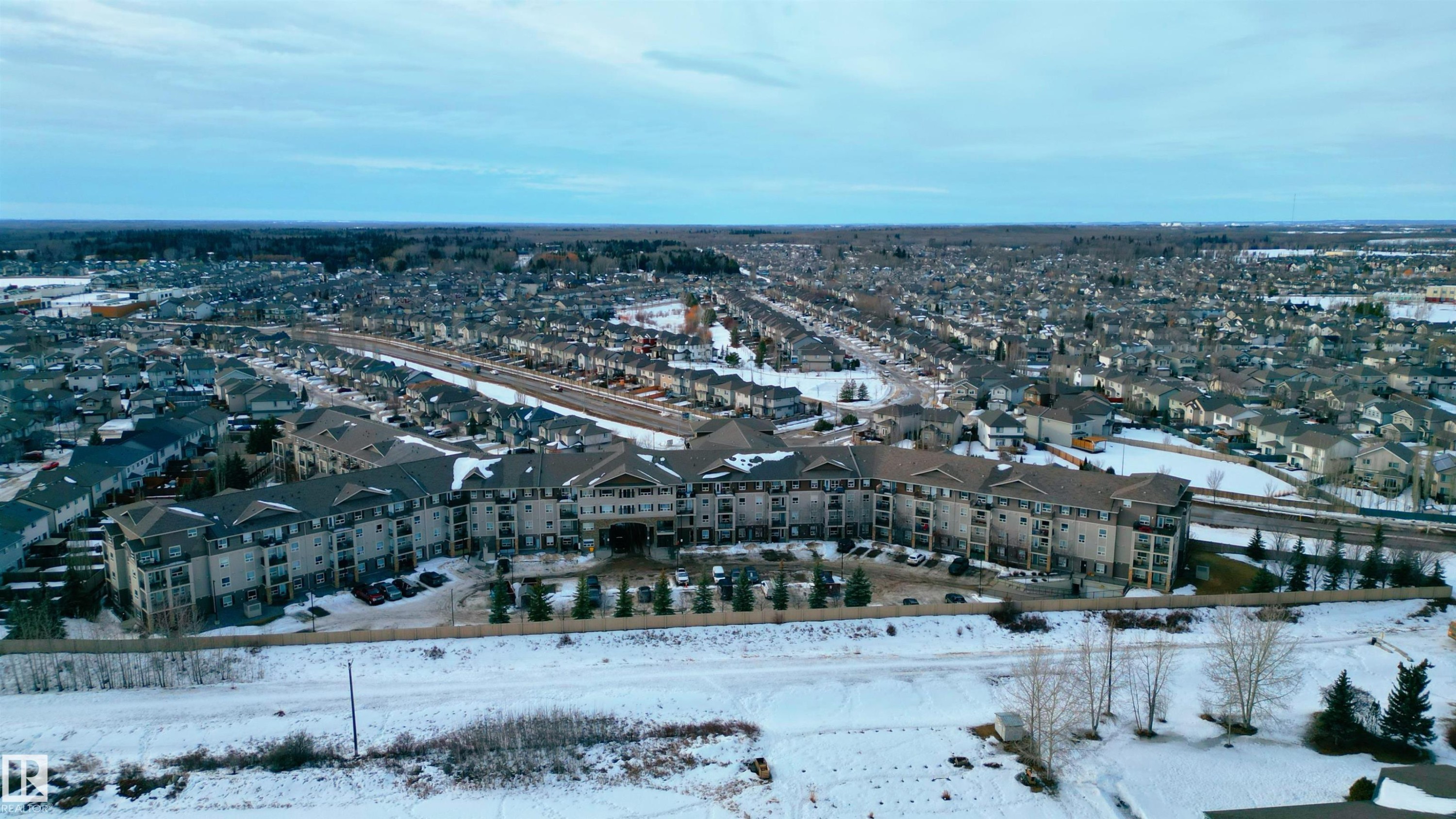 Snowy aerial view featuring a residential view - 325 1520 Hammond Gate, Edmonton, AB - Outdoor With View