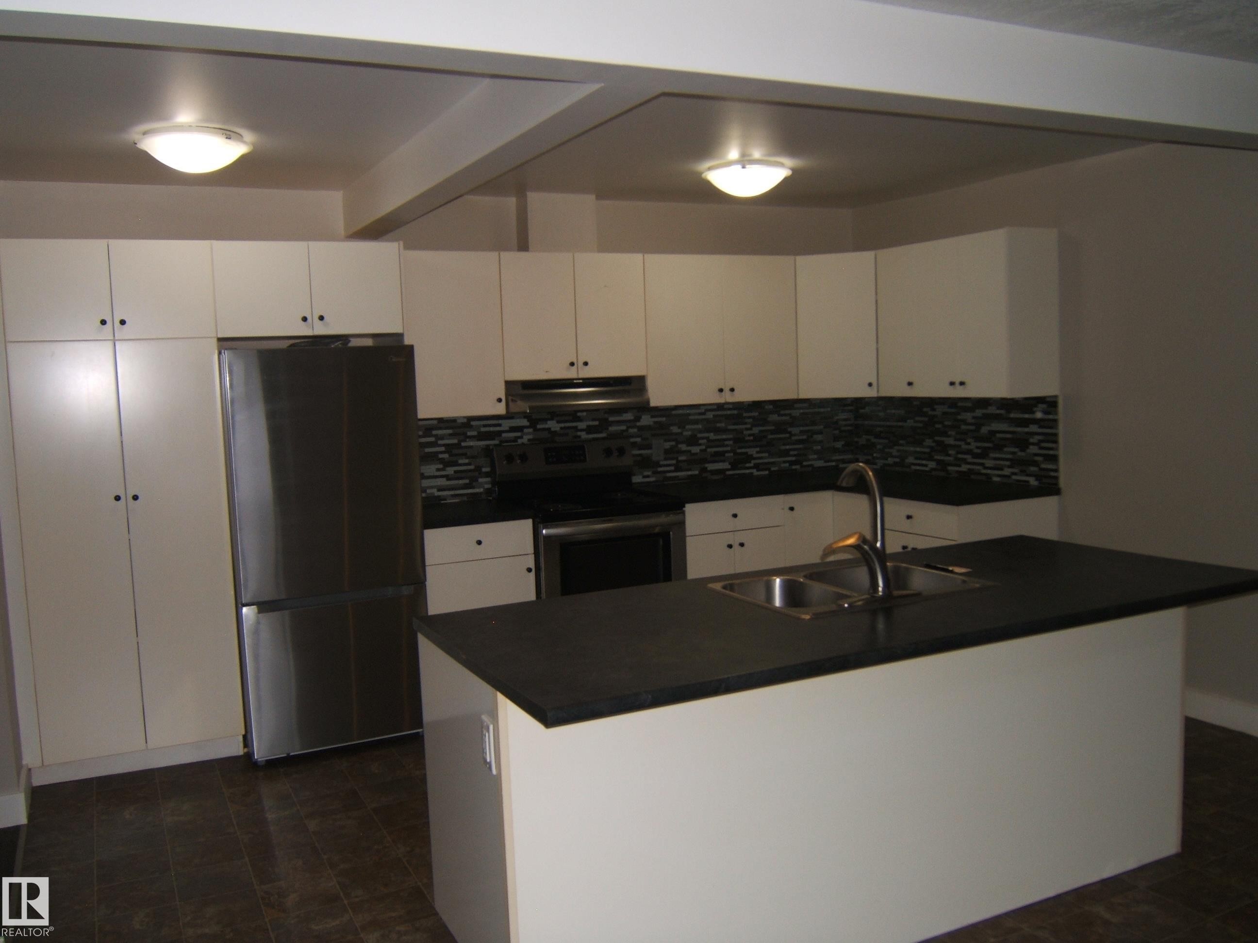 4901 47 Avenue, Myrnam, AB - Indoor Photo Showing Kitchen With Double Sink