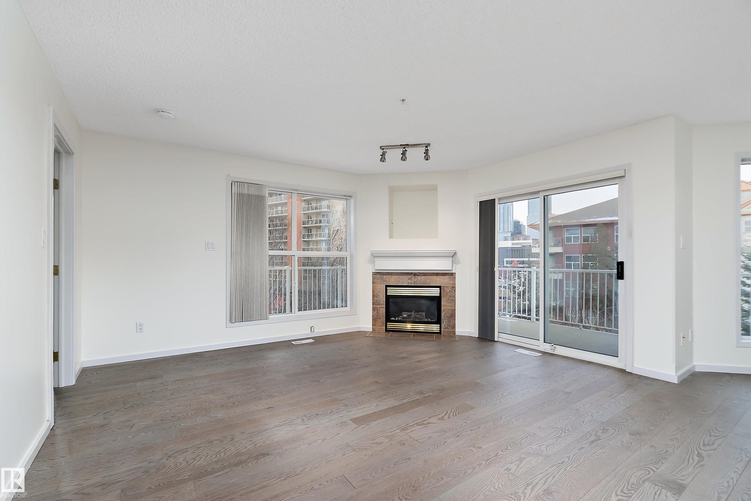409 10221 111 Street, Edmonton, AB - Indoor Photo Showing Living Room With Fireplace