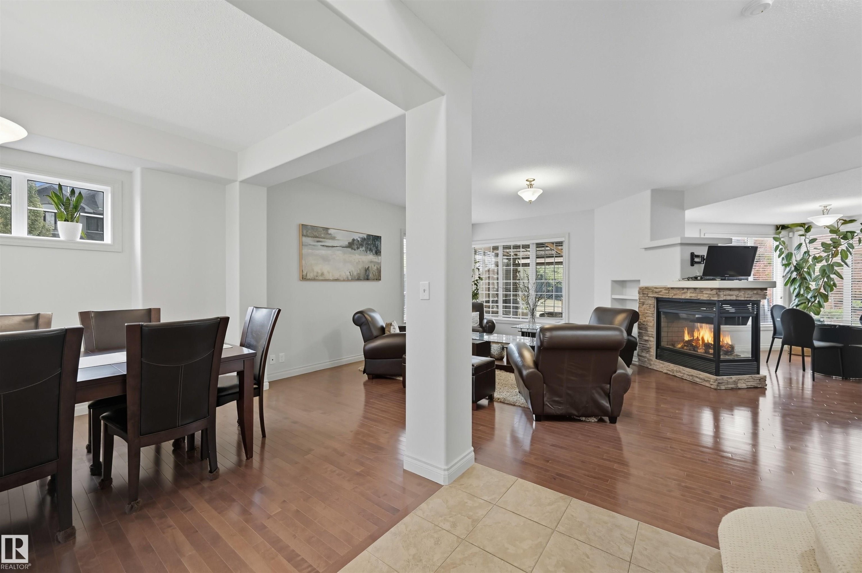 3411 Macneil Link, Edmonton, AB - Indoor Photo Showing Dining Room With Fireplace