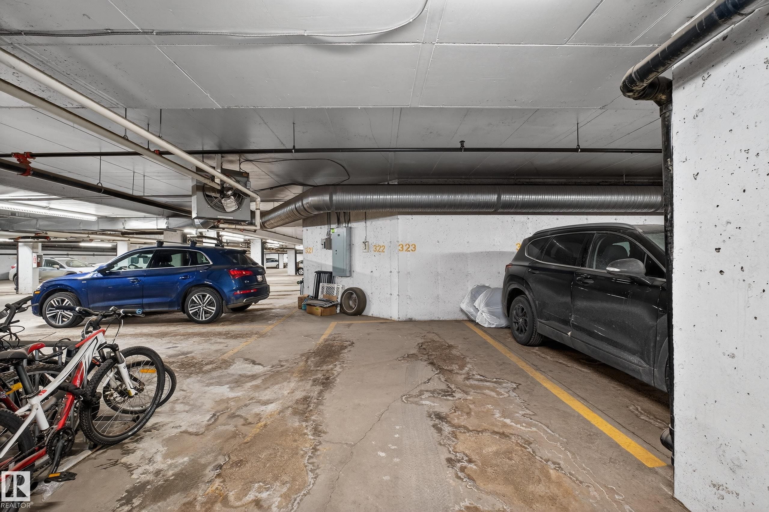 Parking deck featuring electric panel - 131 1520 Hammond Gate, Edmonton, AB - Indoor Photo Showing Garage