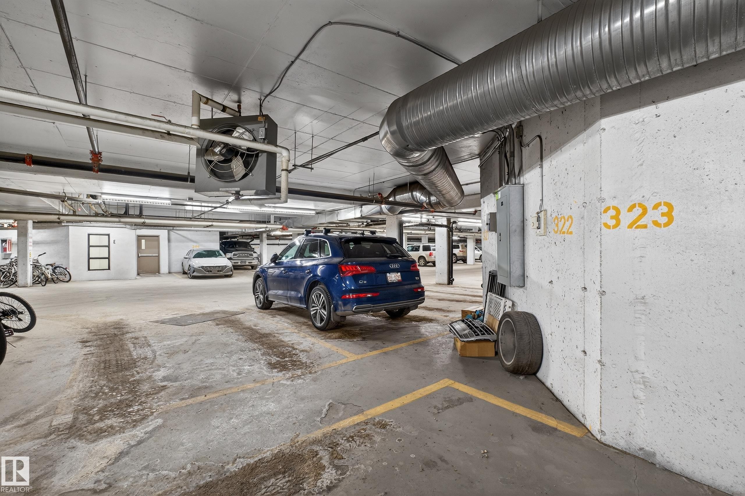 Parking deck with electric panel and a heating unit - 131 1520 Hammond Gate, Edmonton, AB - Indoor Photo Showing Garage