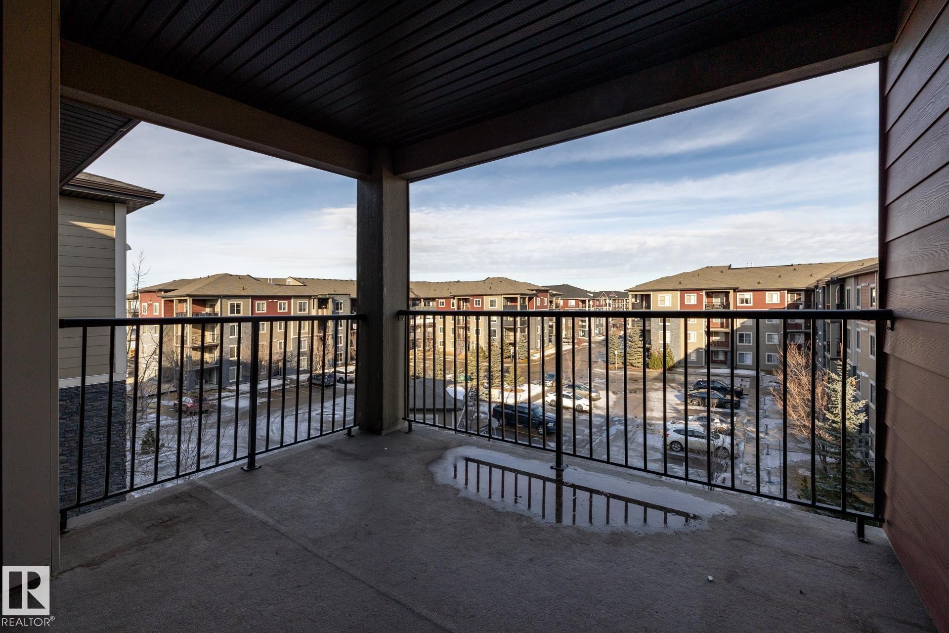 Balcony with a residential view - 433 3315 James Mowatt Trail, Edmonton, AB - Outdoor With Balcony With Exterior
