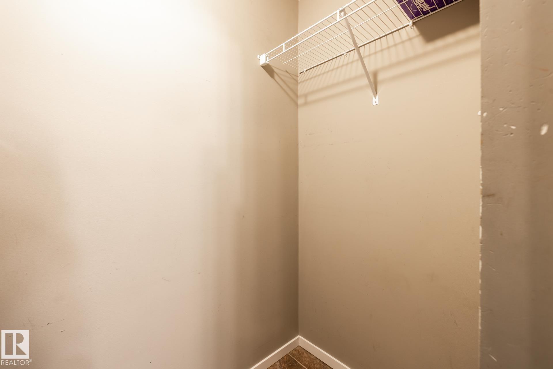 View of walk in closet - 433 3315 James Mowatt Trail, Edmonton, AB - Indoor