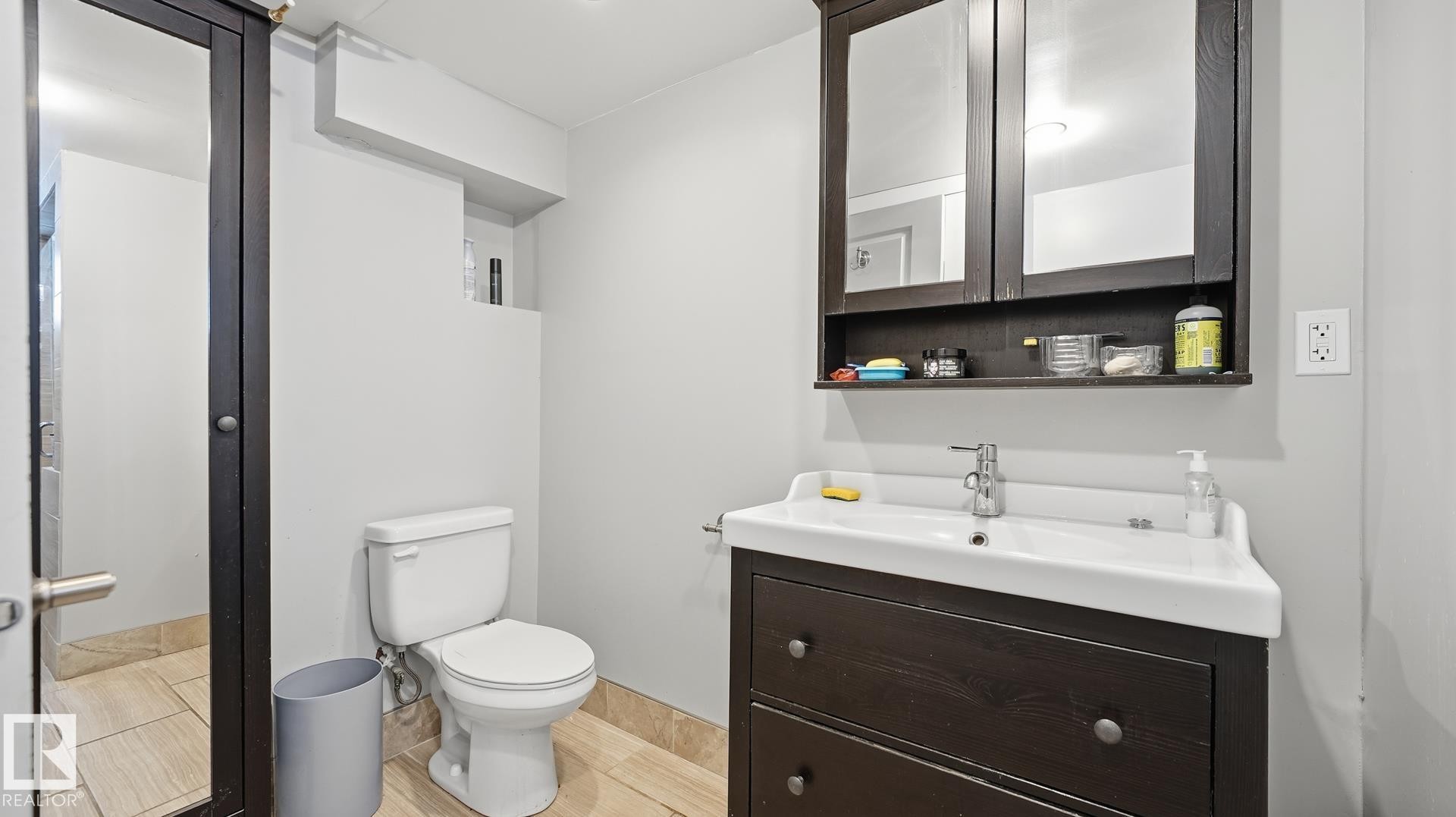 Half bath featuring vanity and toilet - 11520 78 Avenue Nw, Edmonton, AB - Indoor Photo Showing Bathroom