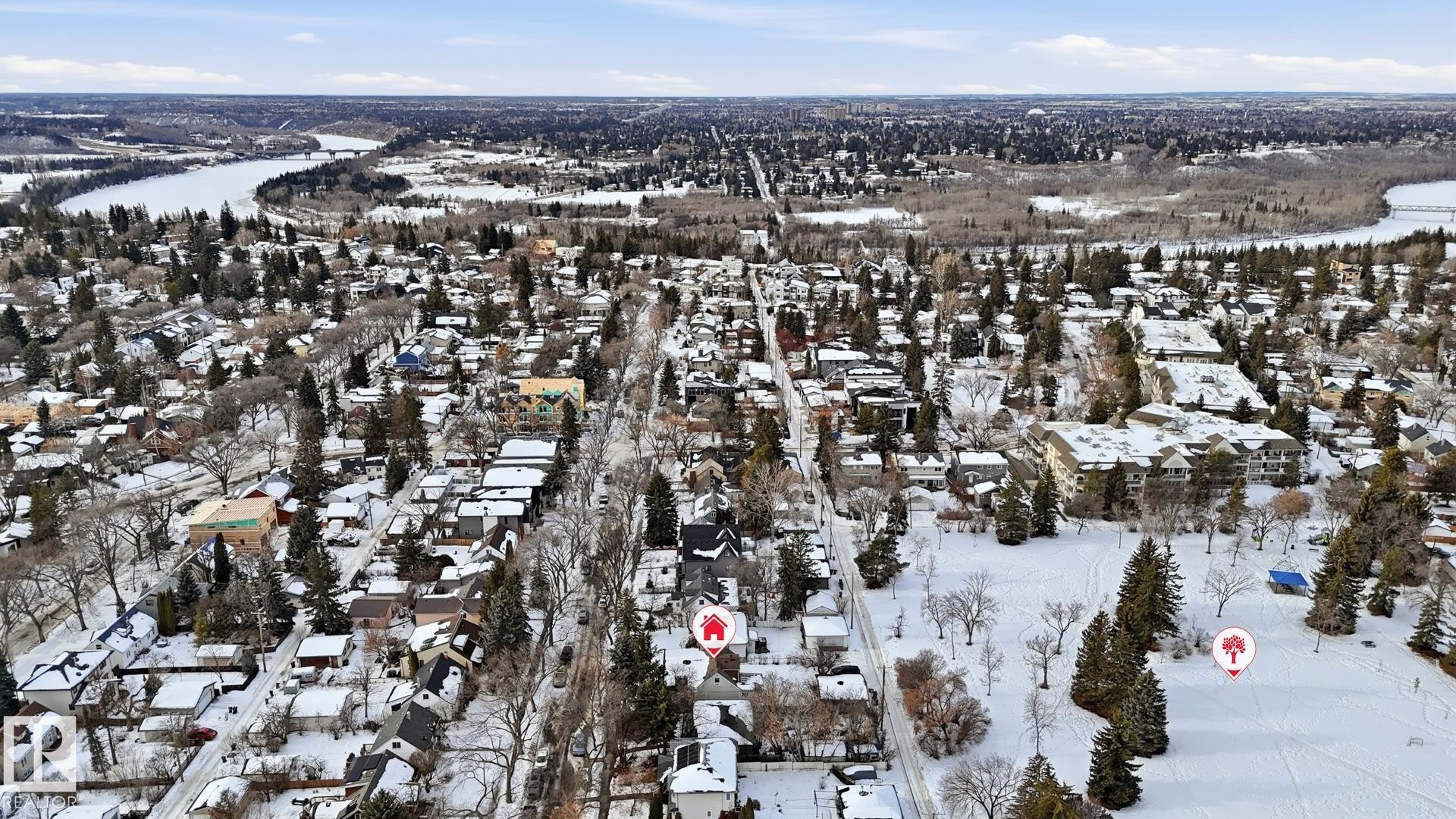 Aerial view of property and surrounding area with nearby suburban area and a large body of water - 11520 78 Avenue Nw, Edmonton, AB - Outdoor With View