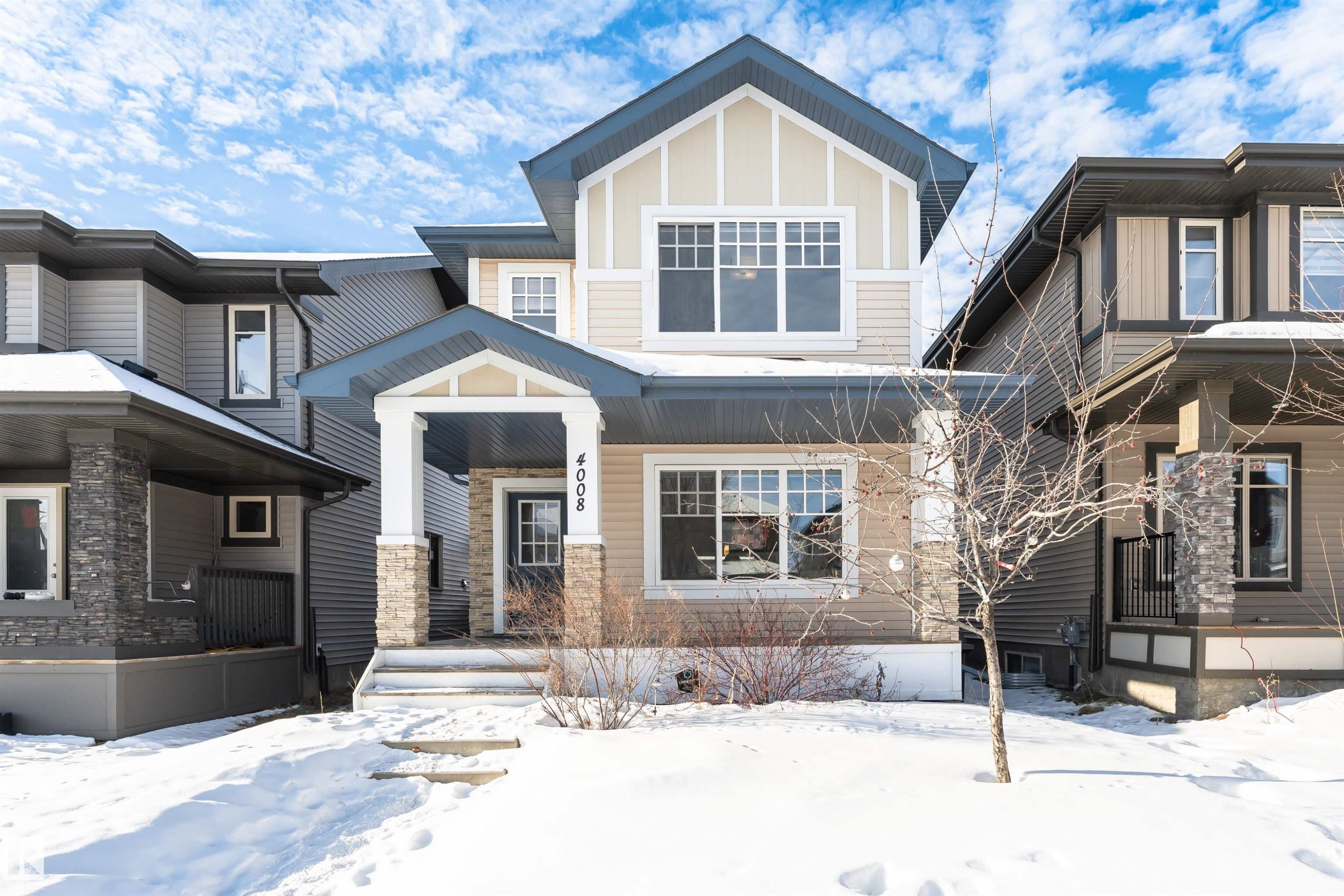 Craftsman-style home with a porch and board and batten siding - 4008 Allan Crescent, Edmonton, AB - Outdoor With Facade