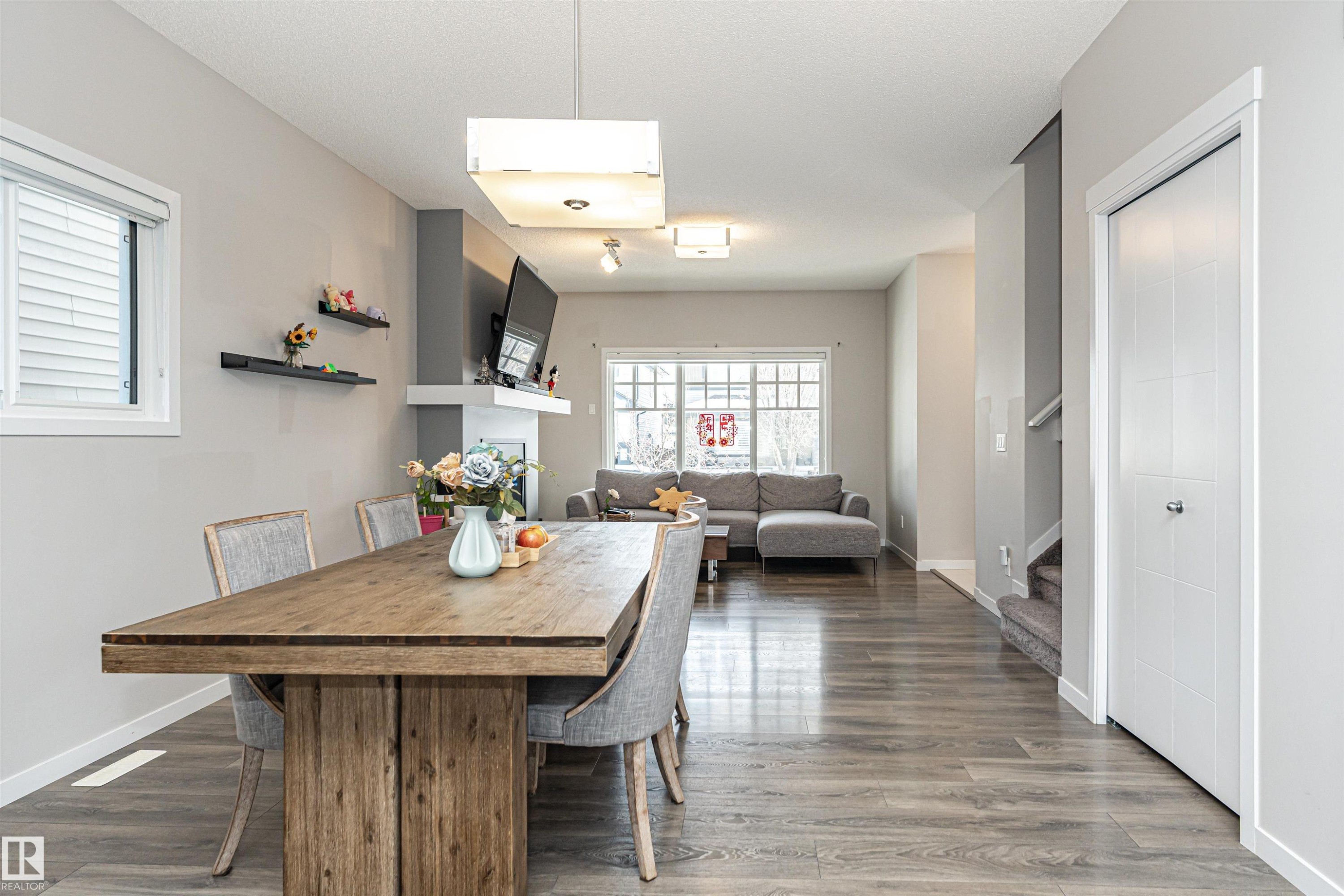 Dining room featuring baseboards and dark wood-type flooring - 4008 Allan Crescent, Edmonton, AB - Indoor Photo Showing Dining Room