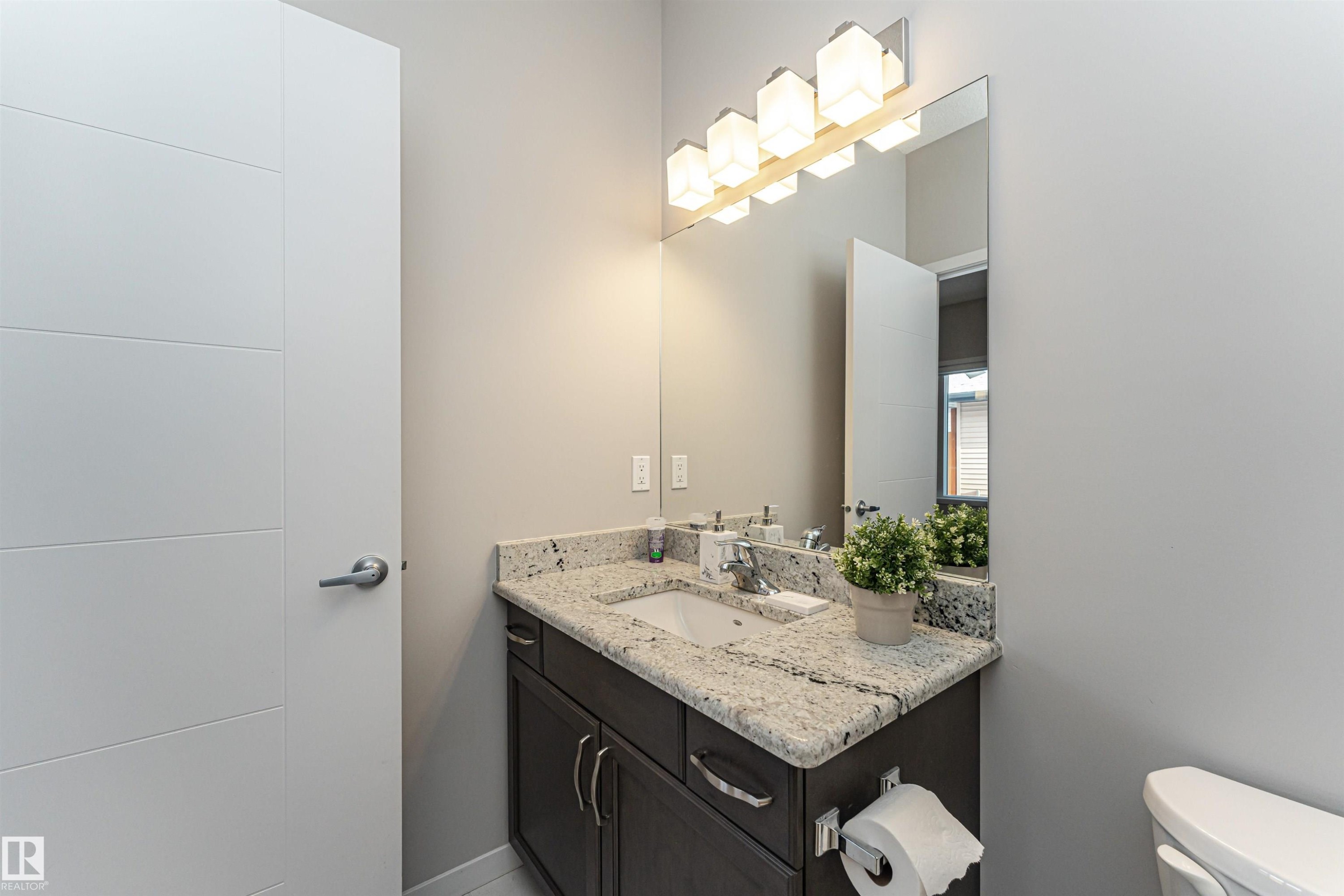 Bathroom with vanity and toilet - 4008 Allan Crescent, Edmonton, AB - Indoor Photo Showing Bathroom